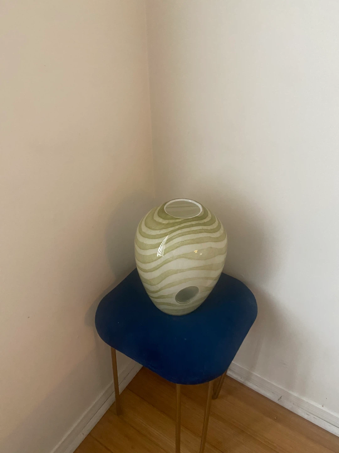 Glass vase with green wavy pattern