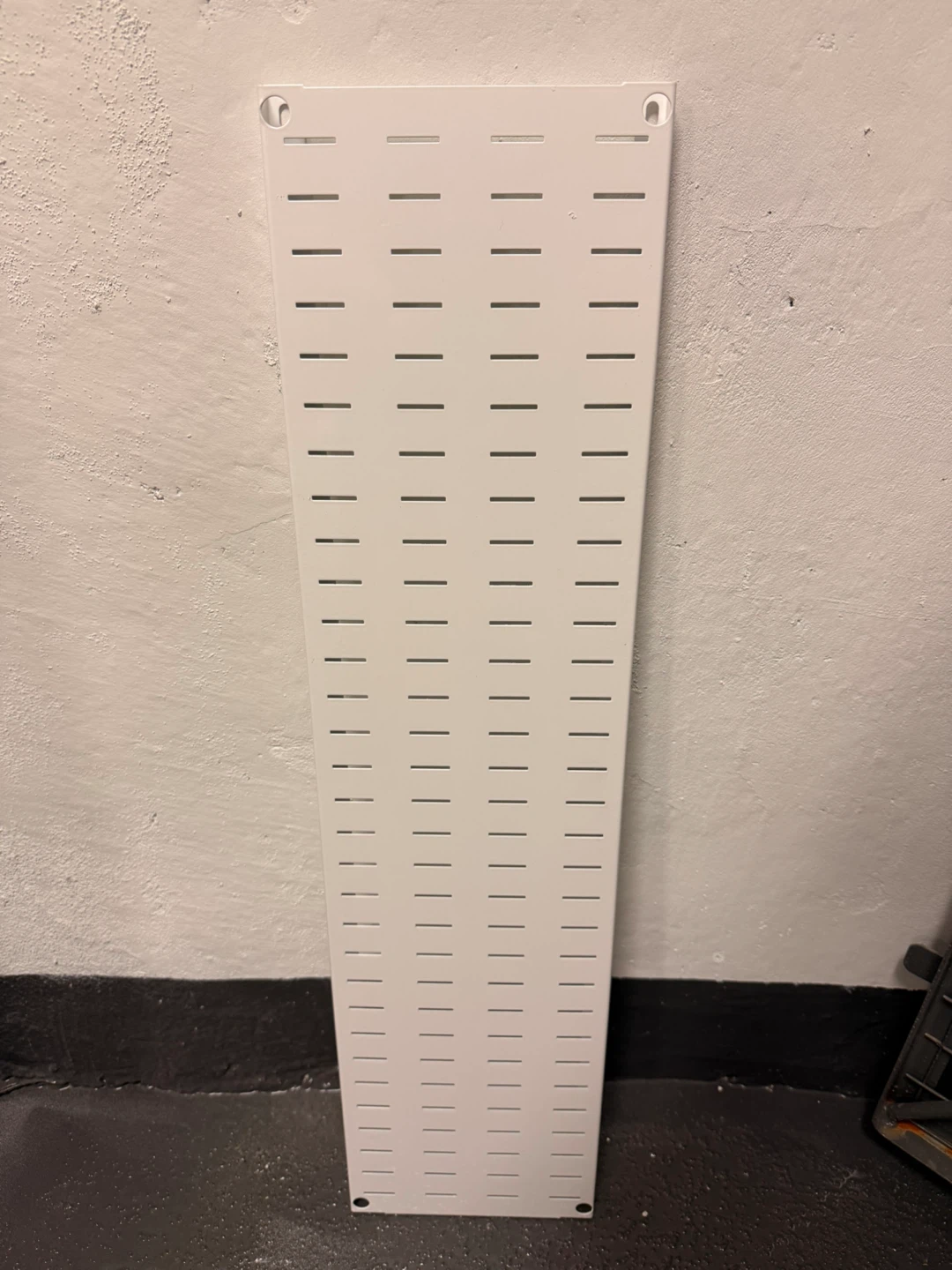 White pegboard panel