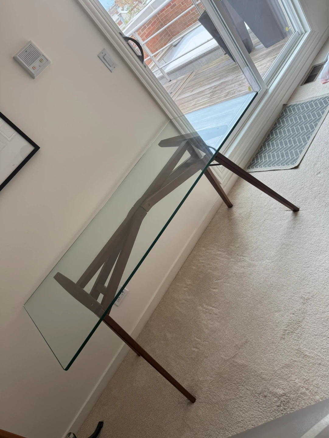 Dinning table with glass top wooden Legs