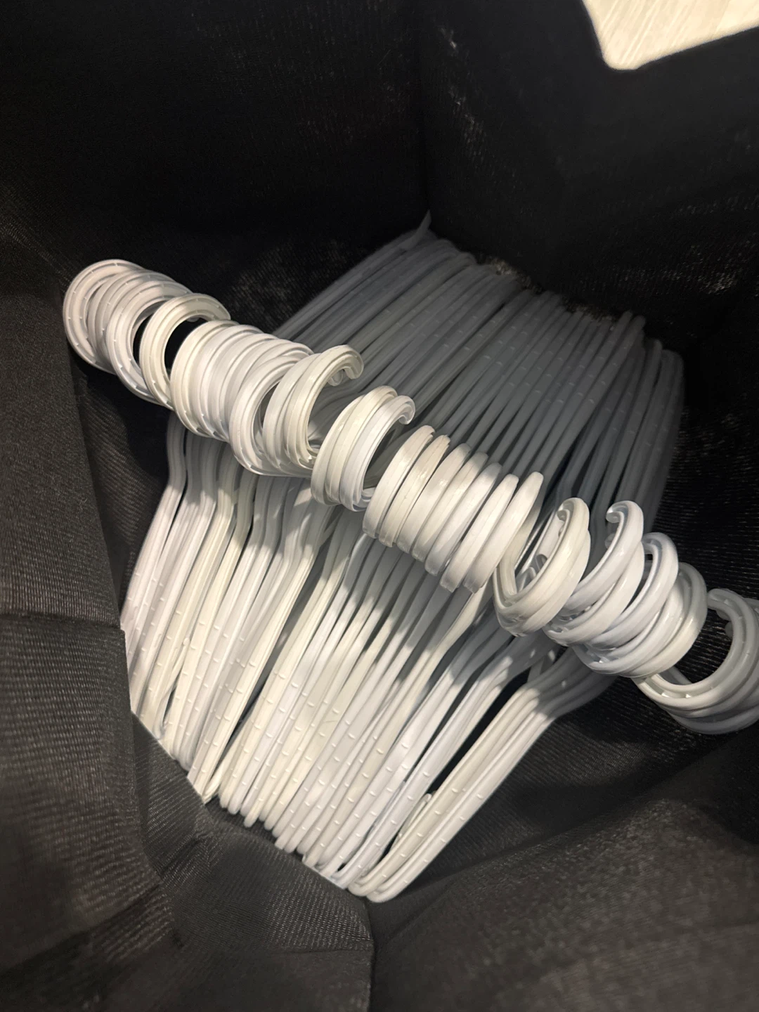 Bundle of White Plastic Hangers