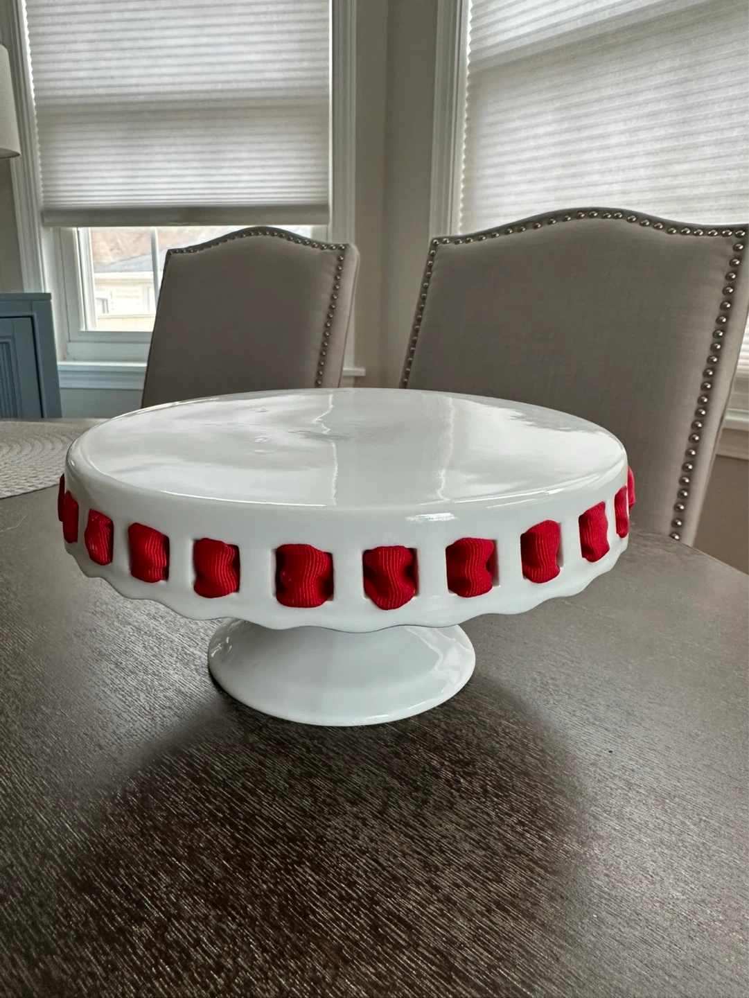 White Cake Stand with Red Ribbon Accents
