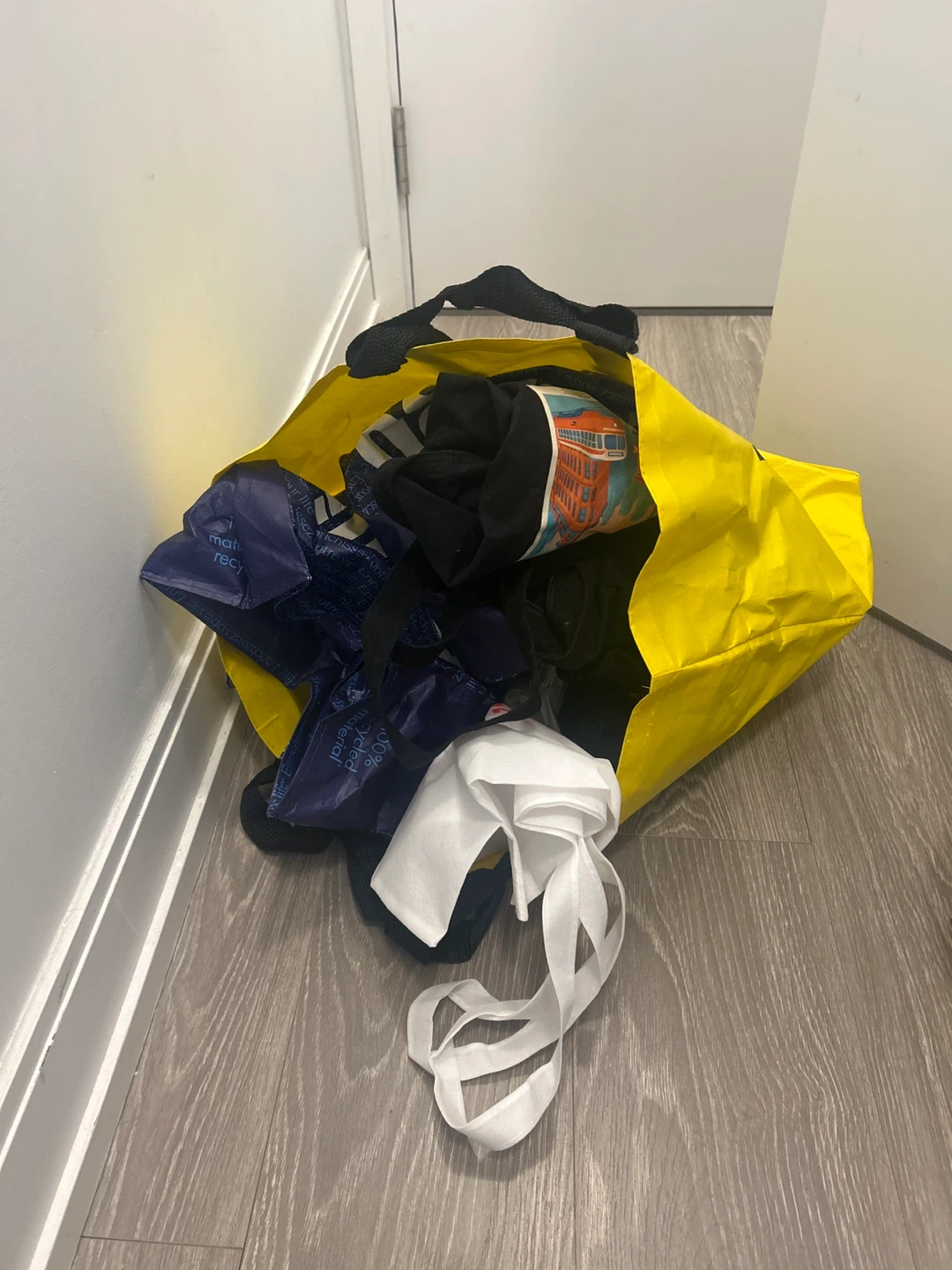Yellow tote bag with assorted bags