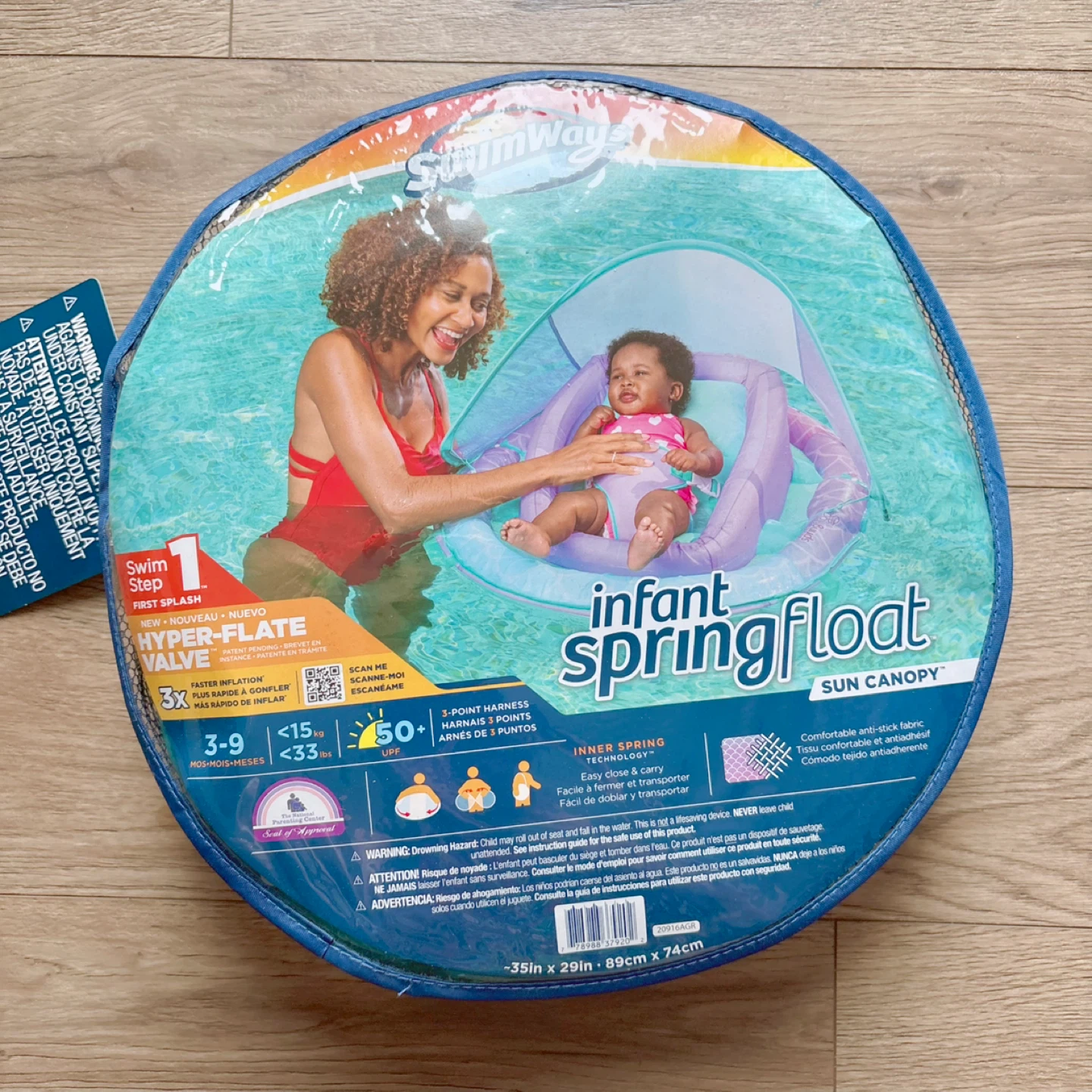 Brand new SwimWays infant spring float with sun canopy