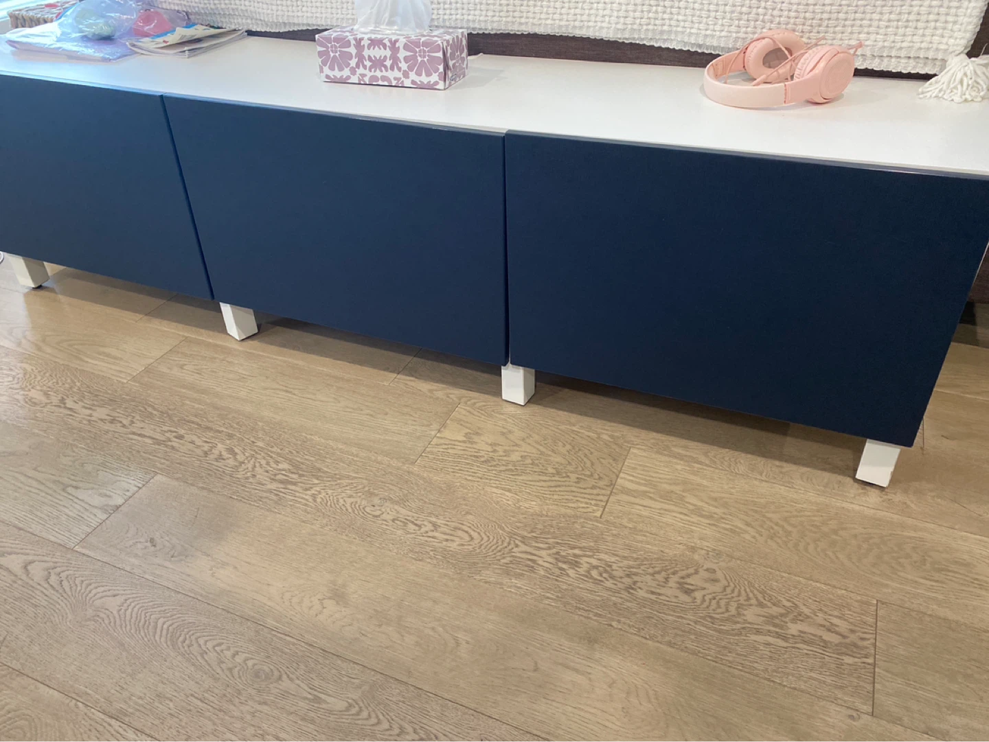 Navy blue cabinet with white top and legs