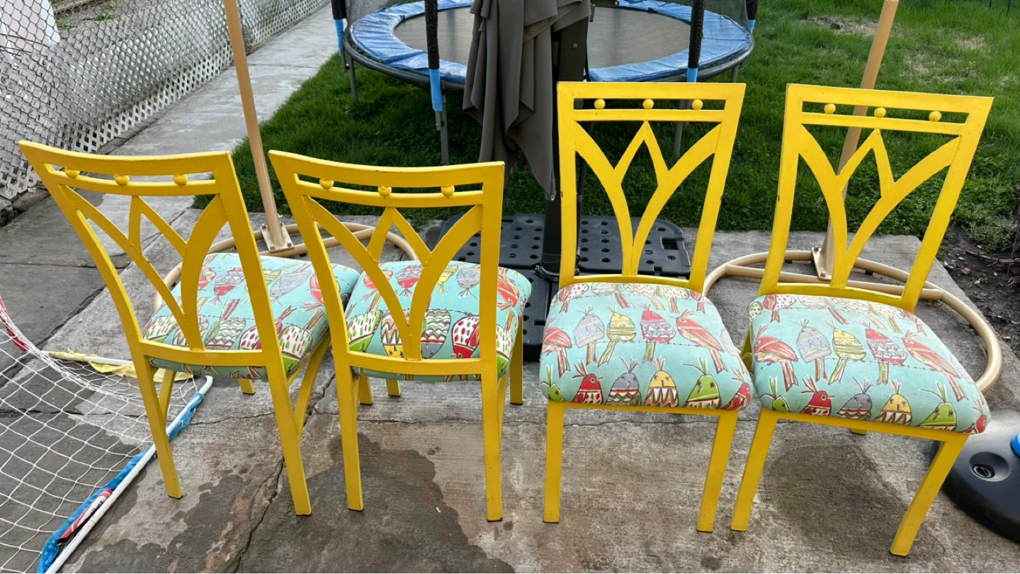 4 Yellow accent chairs with fun bird pattern seat