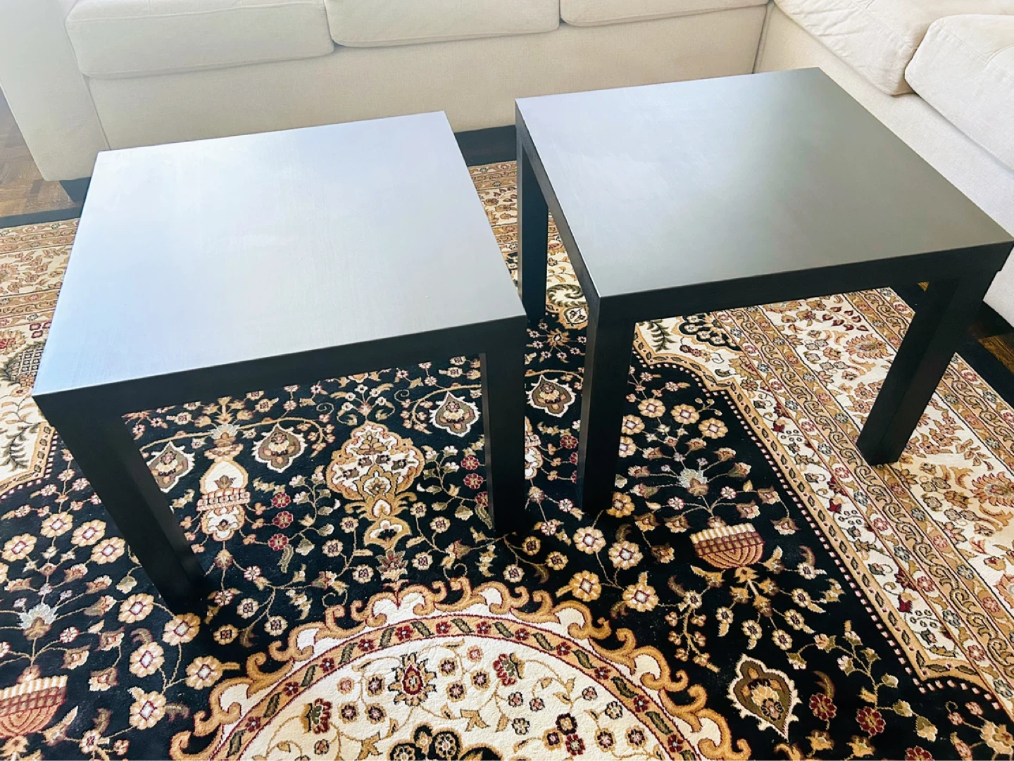 Two black square side IKEA tables