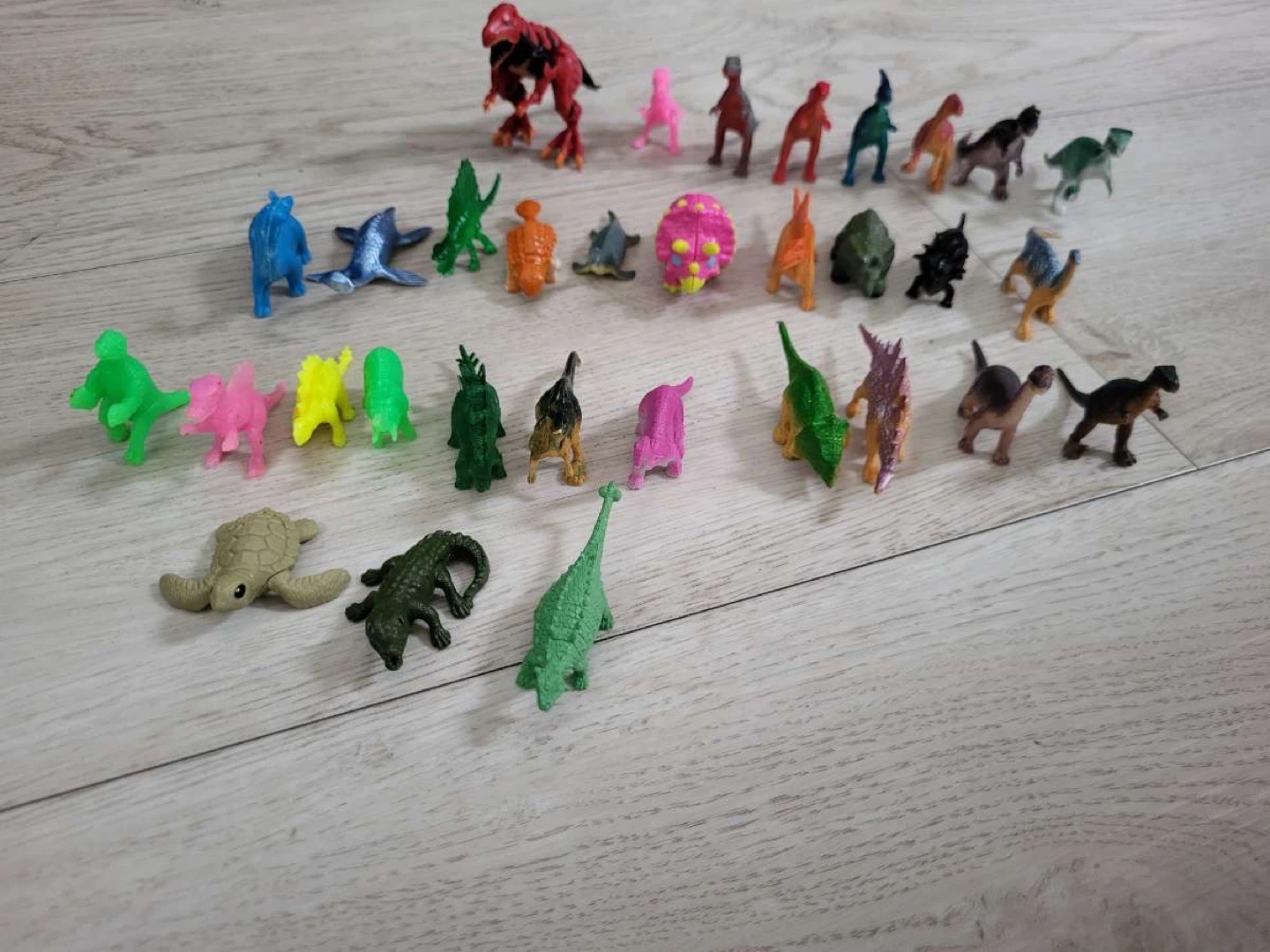 Assorted Lot of Small dinosaurs and frog Figurines