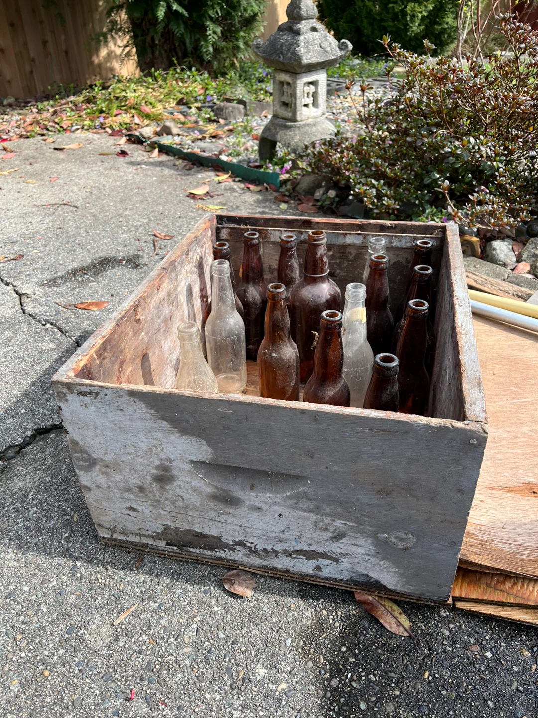 Vintage Assorted Glass Bottles with crate decor