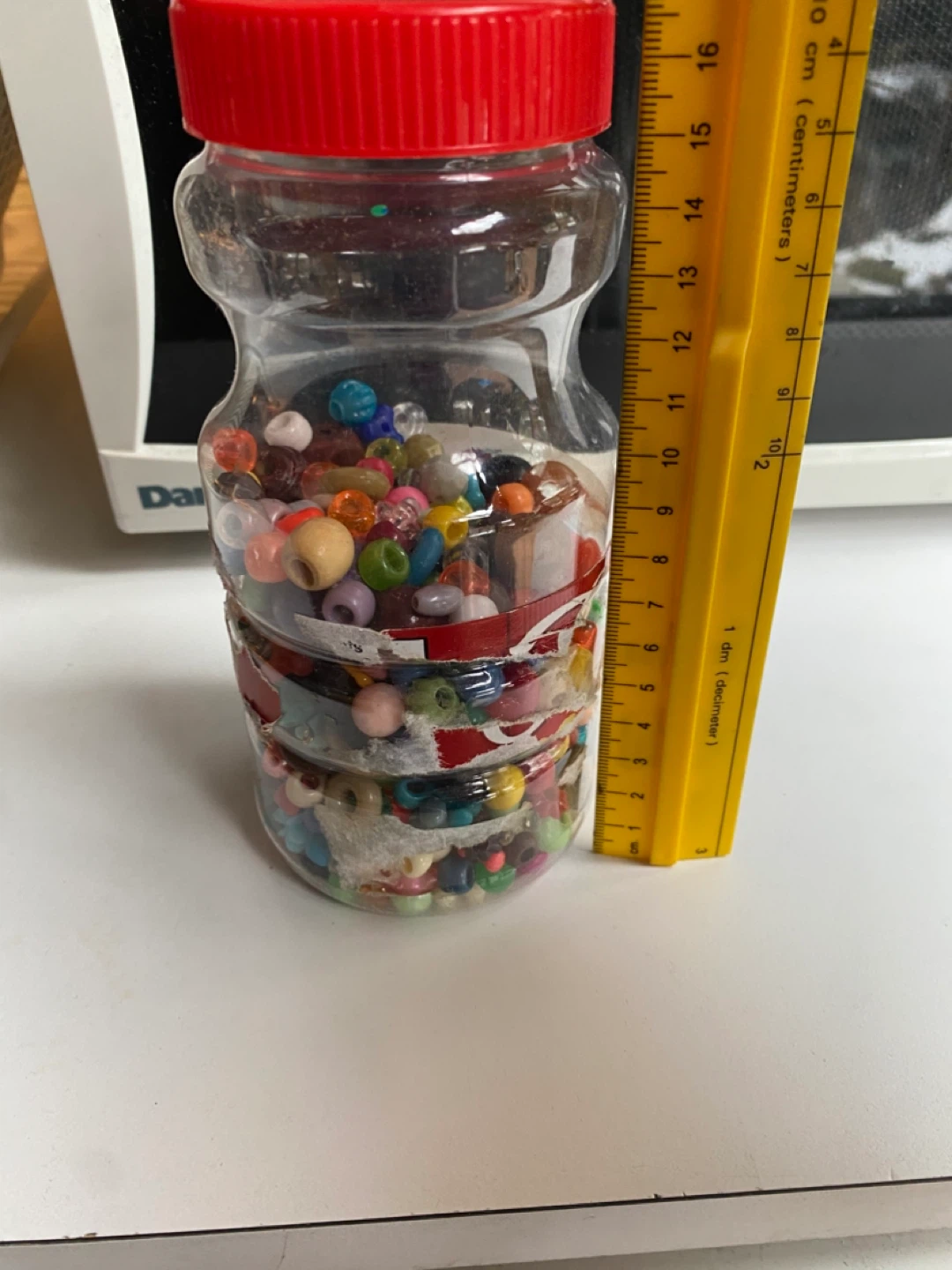 Jar of assorted craft beads