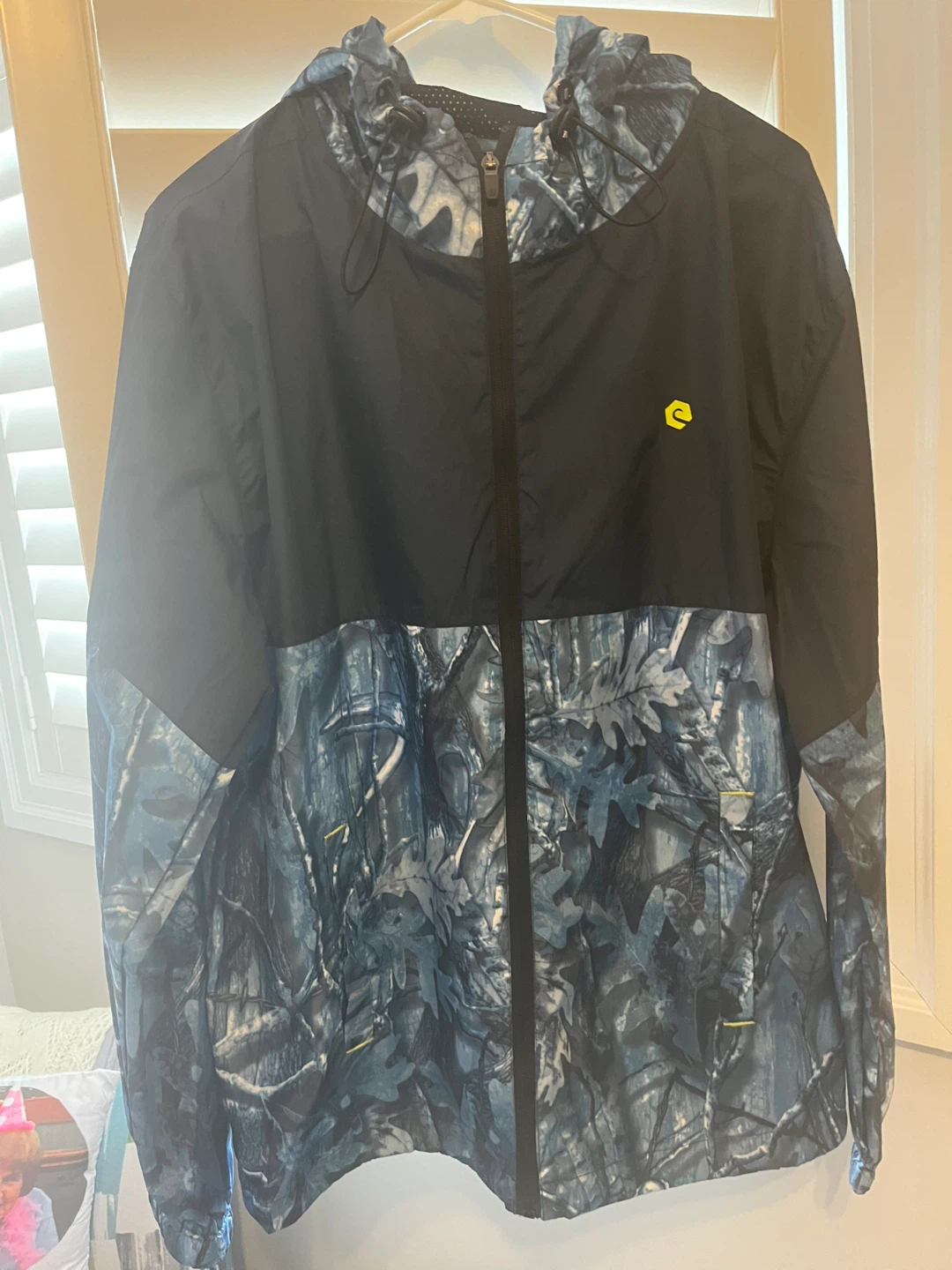 Men’s rain jacket size small but fits loose