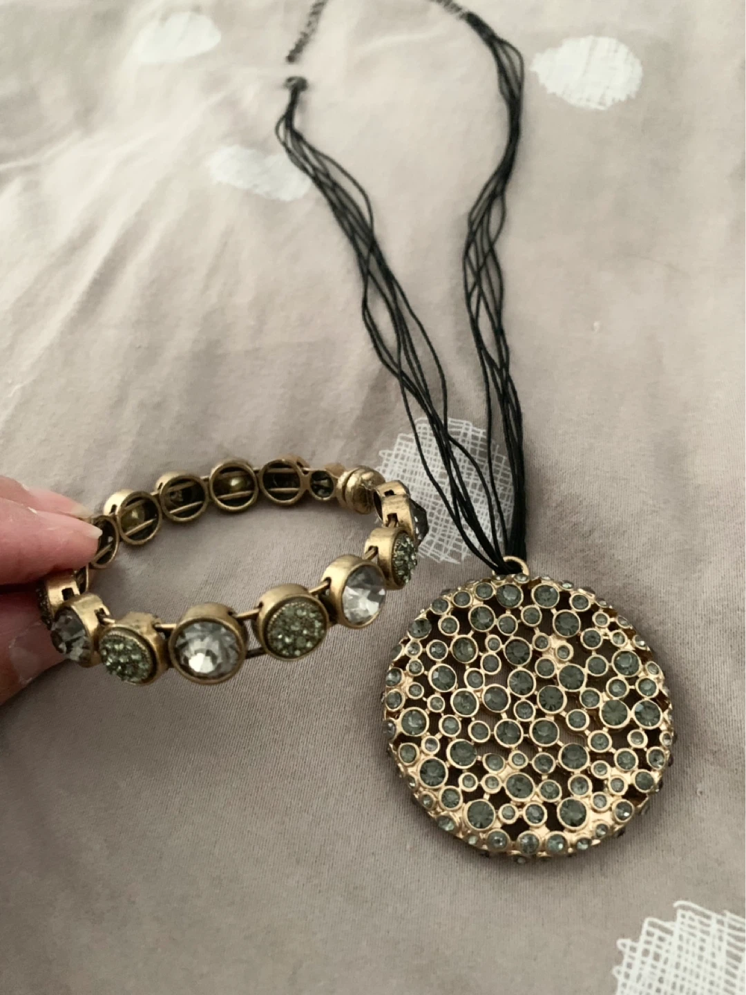 Gold-tone pendant necklace and bracelet set with rhinestones