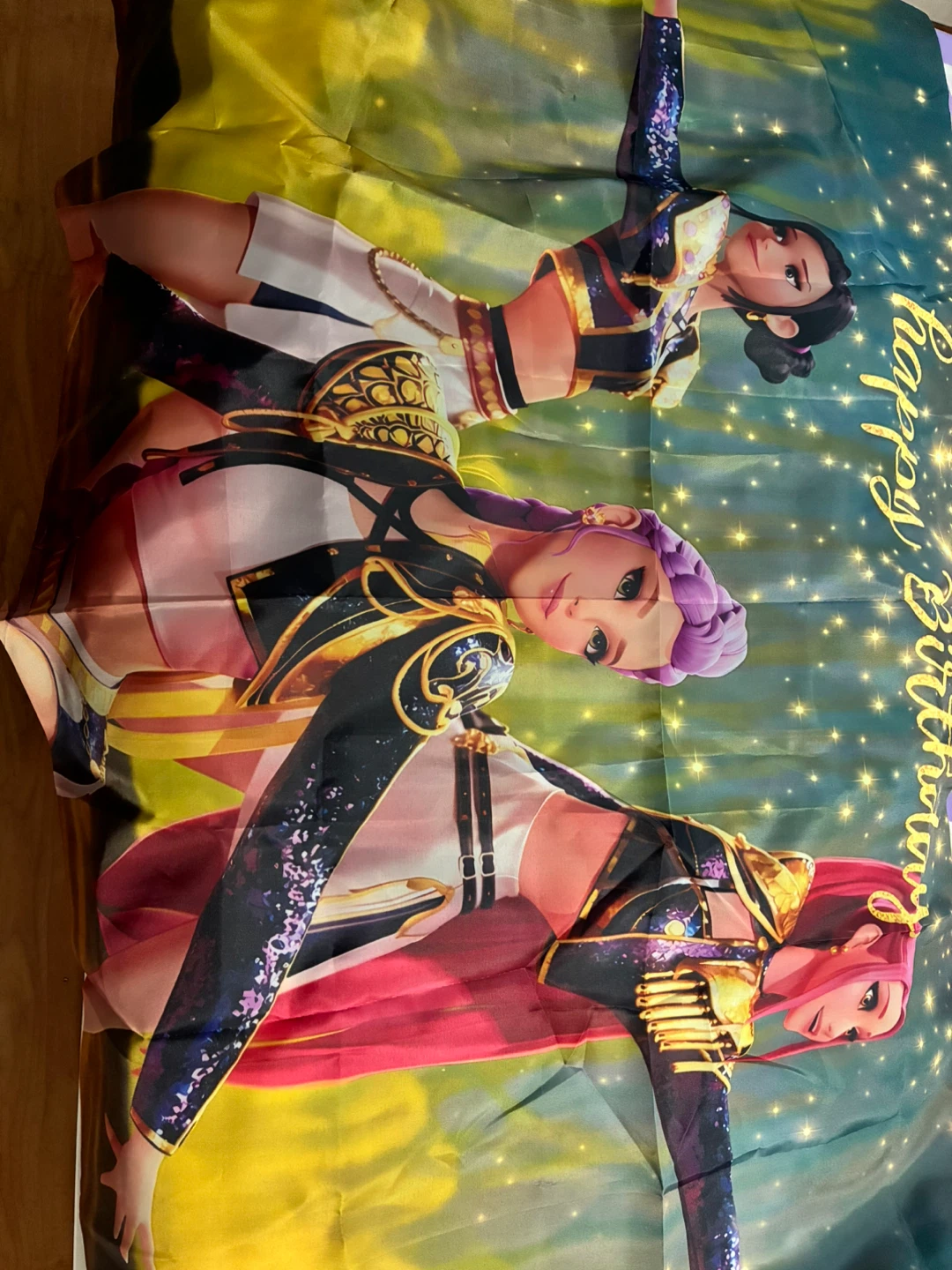 Rumi costume and huntrix birthday banner