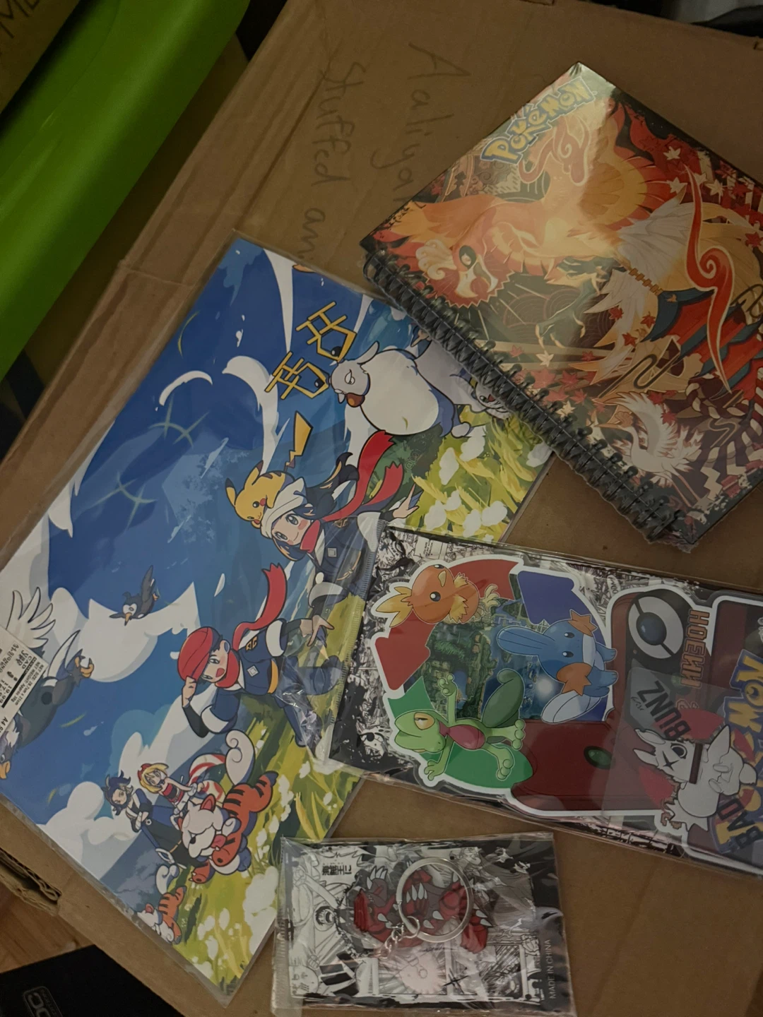 Pokémon Spiral Notebook, poster, stand and keychain