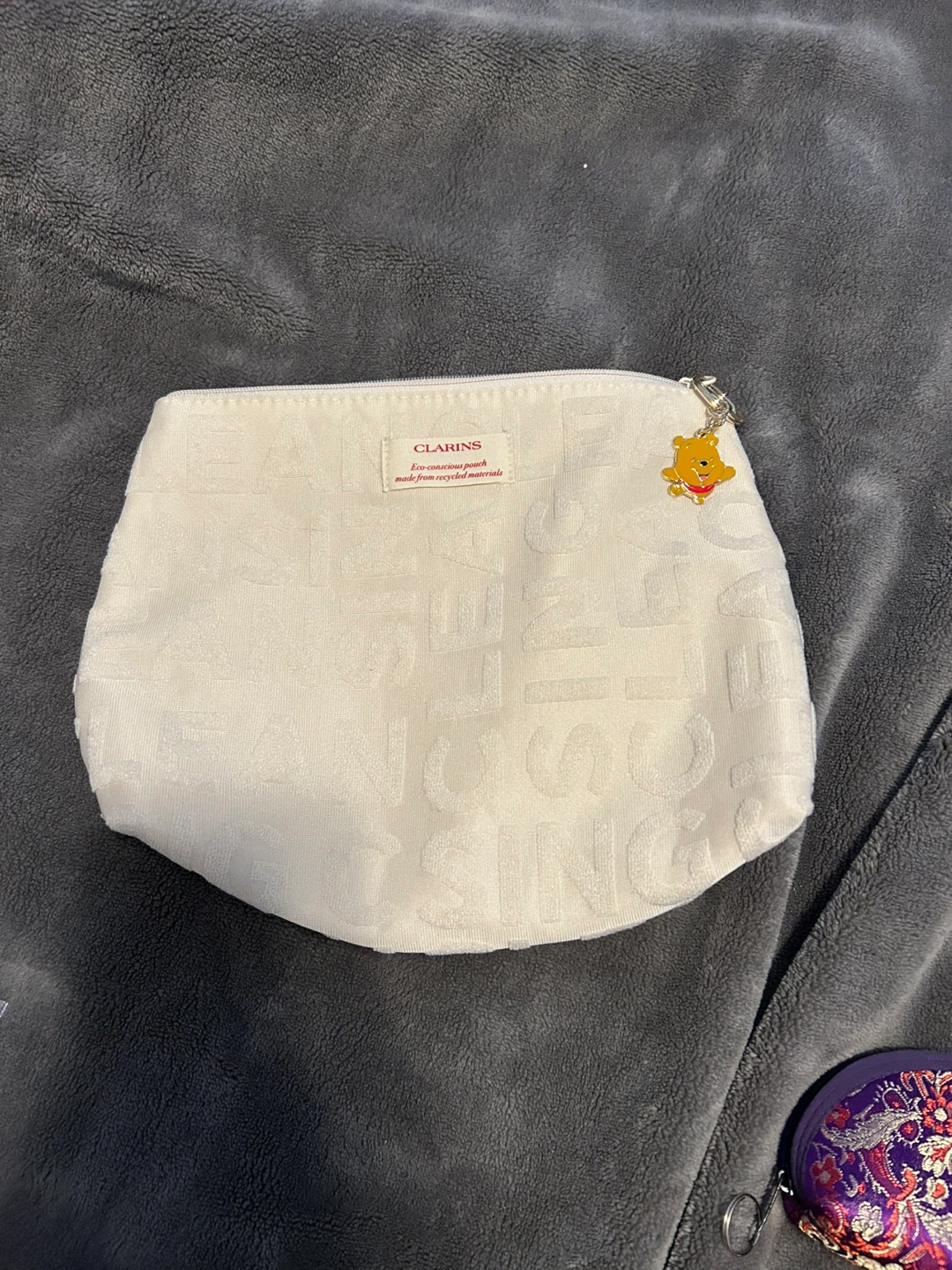 Clarins White Recycled Cosmetic Pouch with Winnie the Pooh Charm