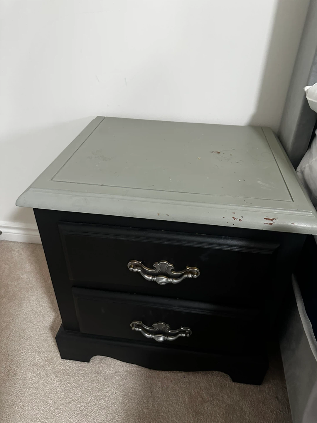 Black two-drawer nightstand with silver hardware