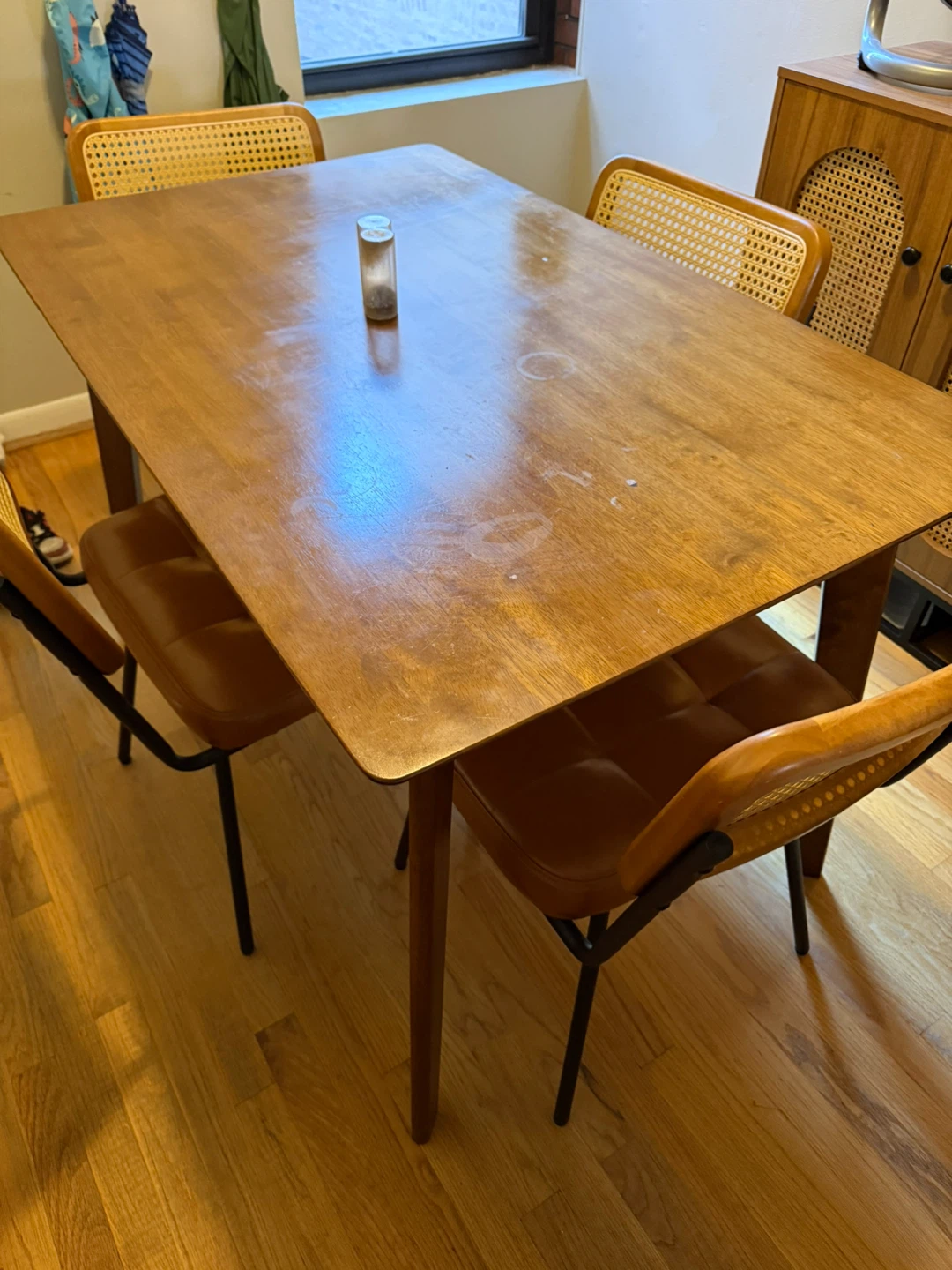 Wooden Dining Table with Rattan Chairs