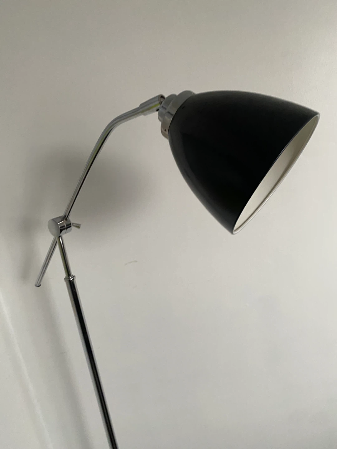 Black adjustable floor lamp with chrome accents