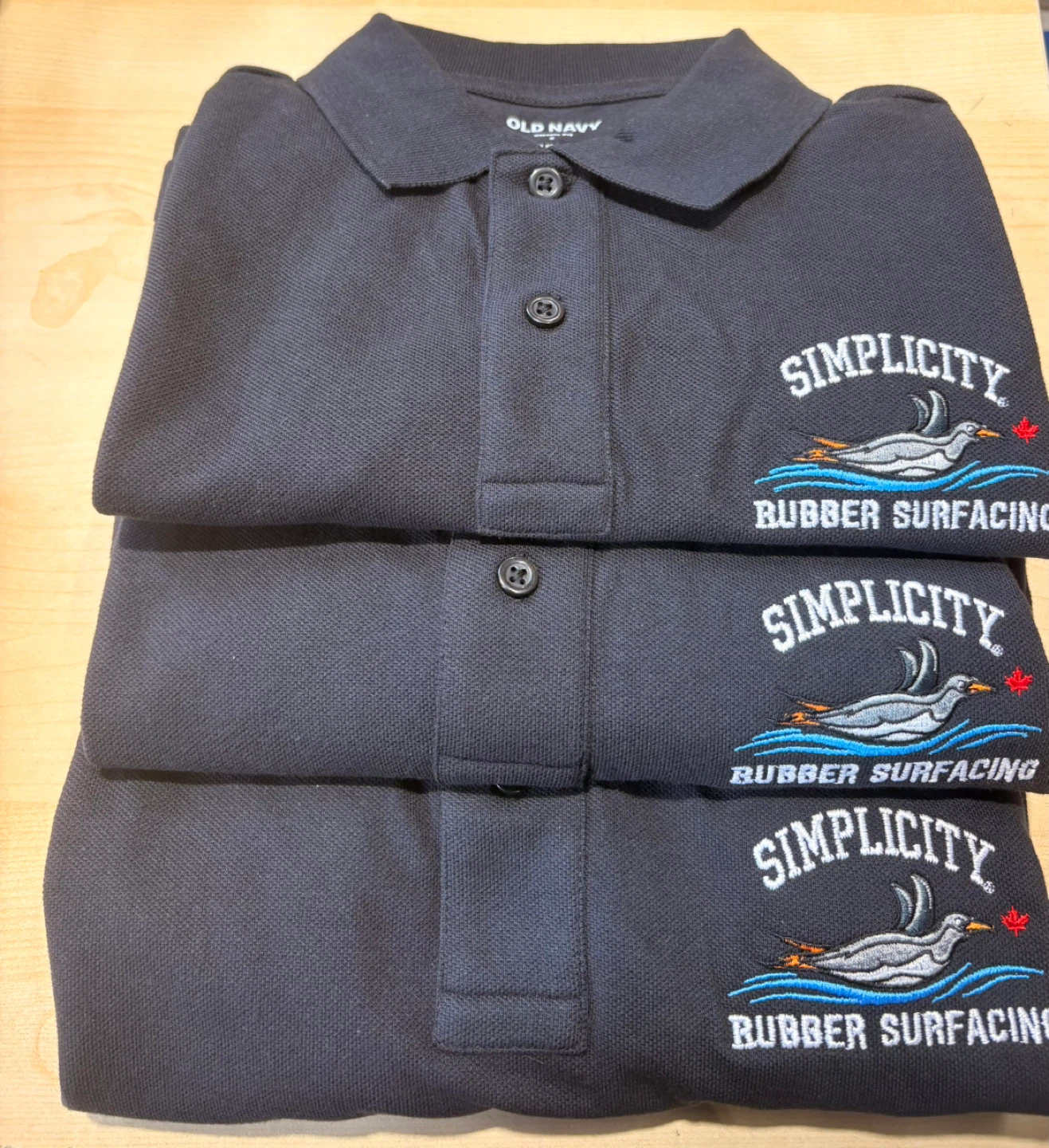 Custom Embroidery "Simplicity Rubber Surfacing" Polo Shirts