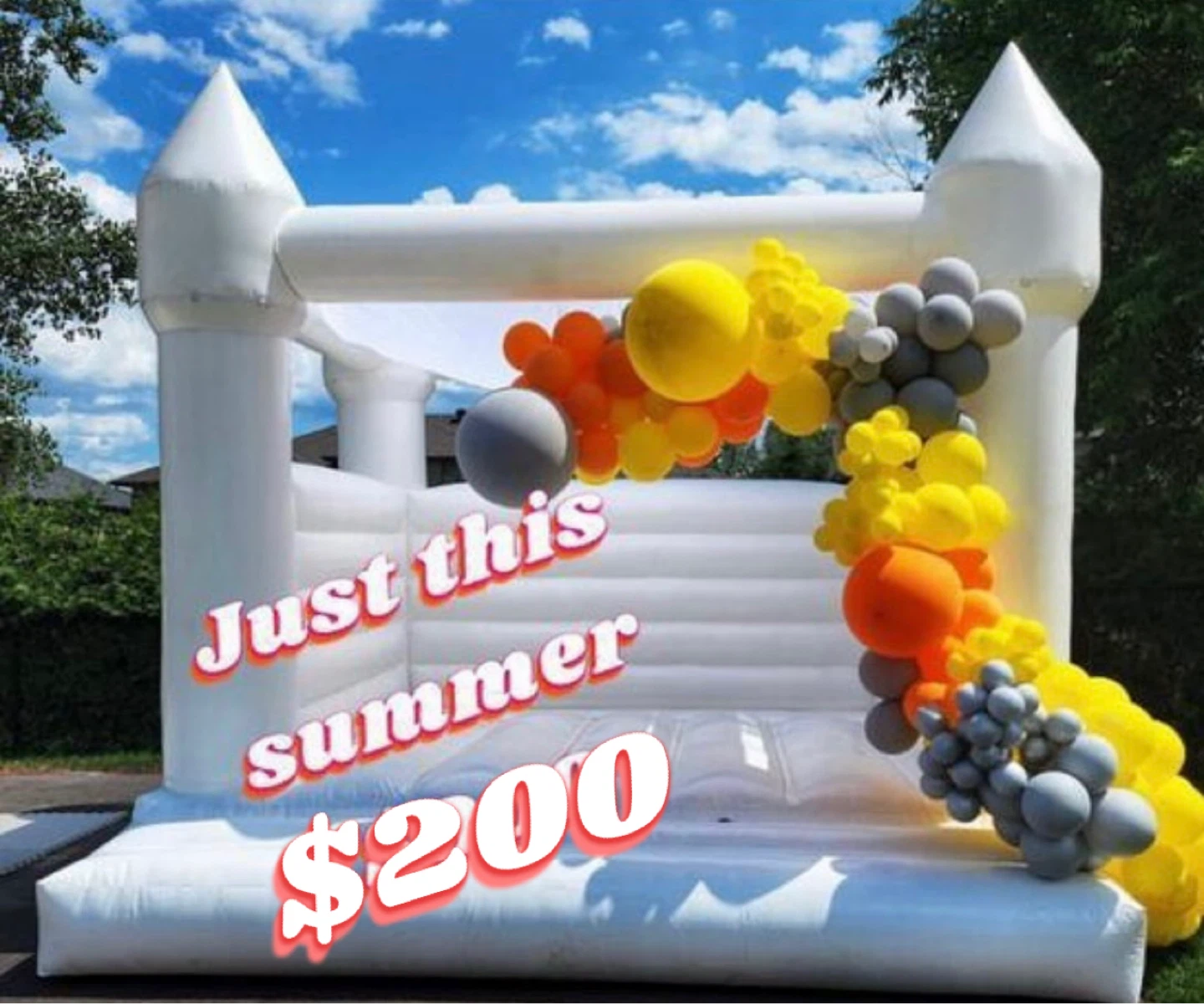 White Inflatable Bounce House with Balloon Arch