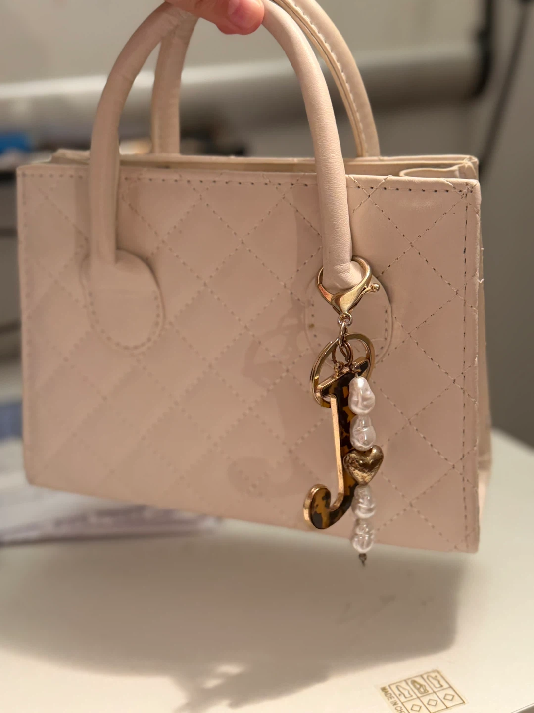 Quilted Top Handle mini Handbag with Charm