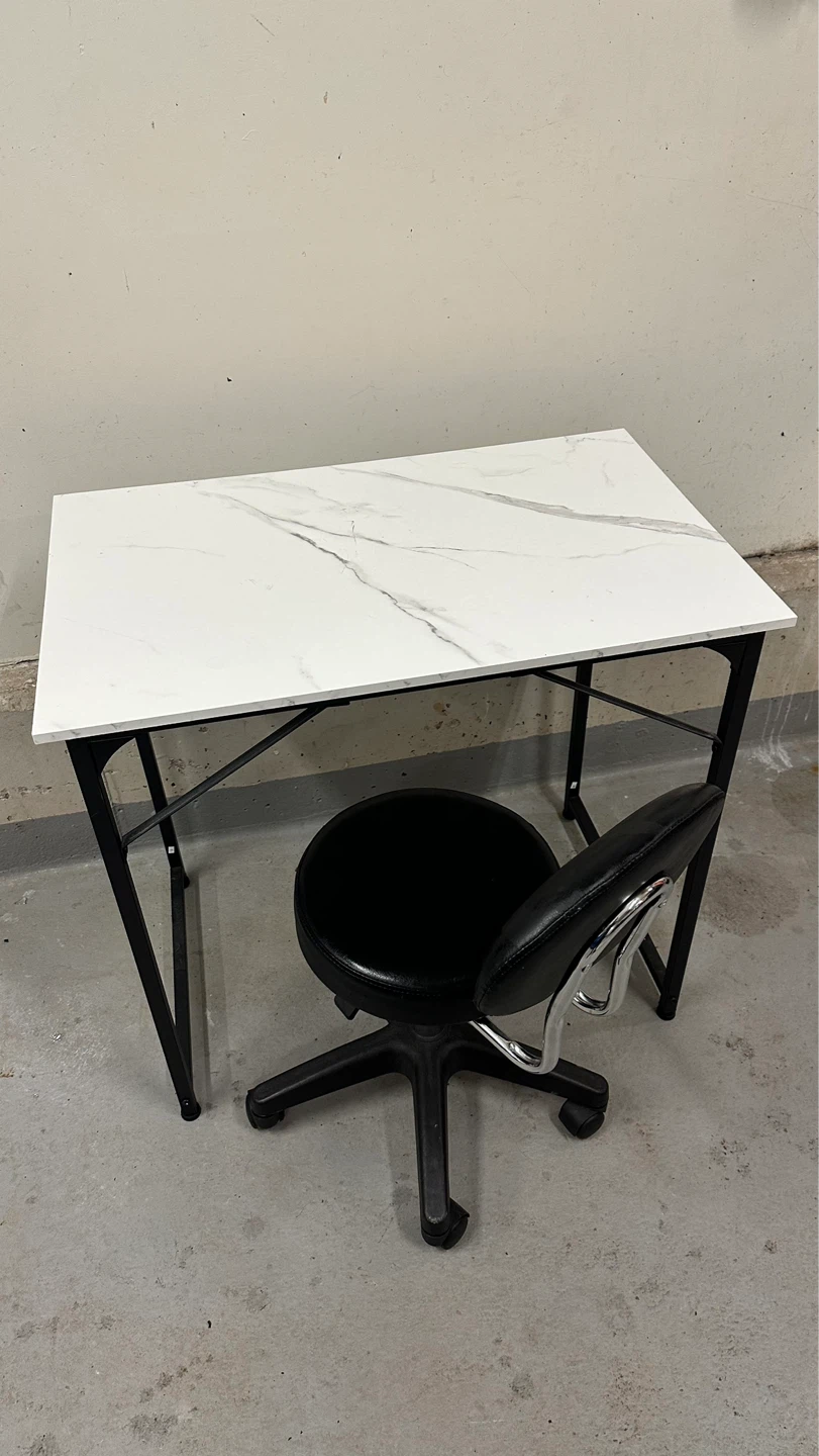 Marble top desk and black office chair