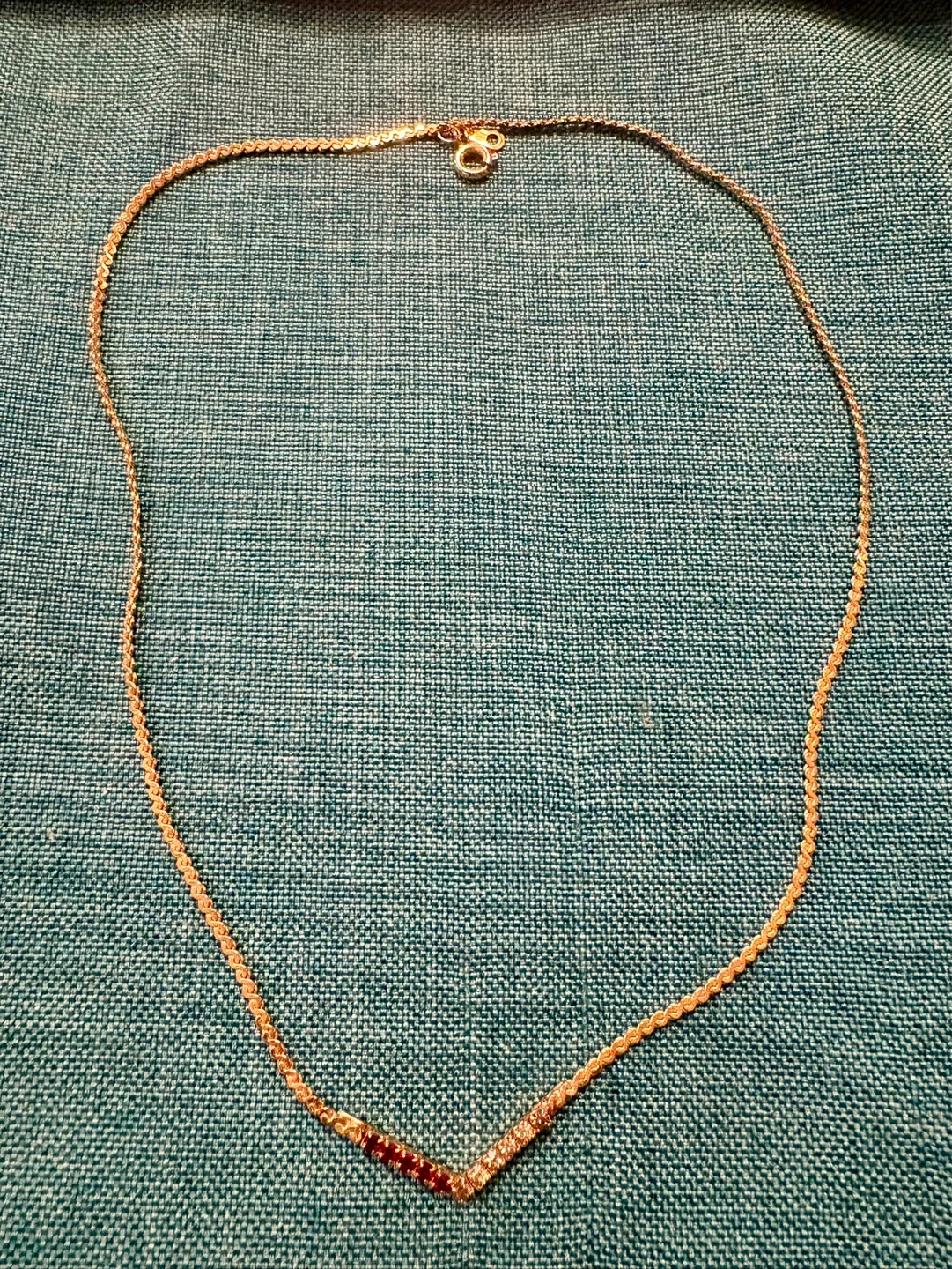 Gold-tone V-shape necklace with red and clear stones - photo 2