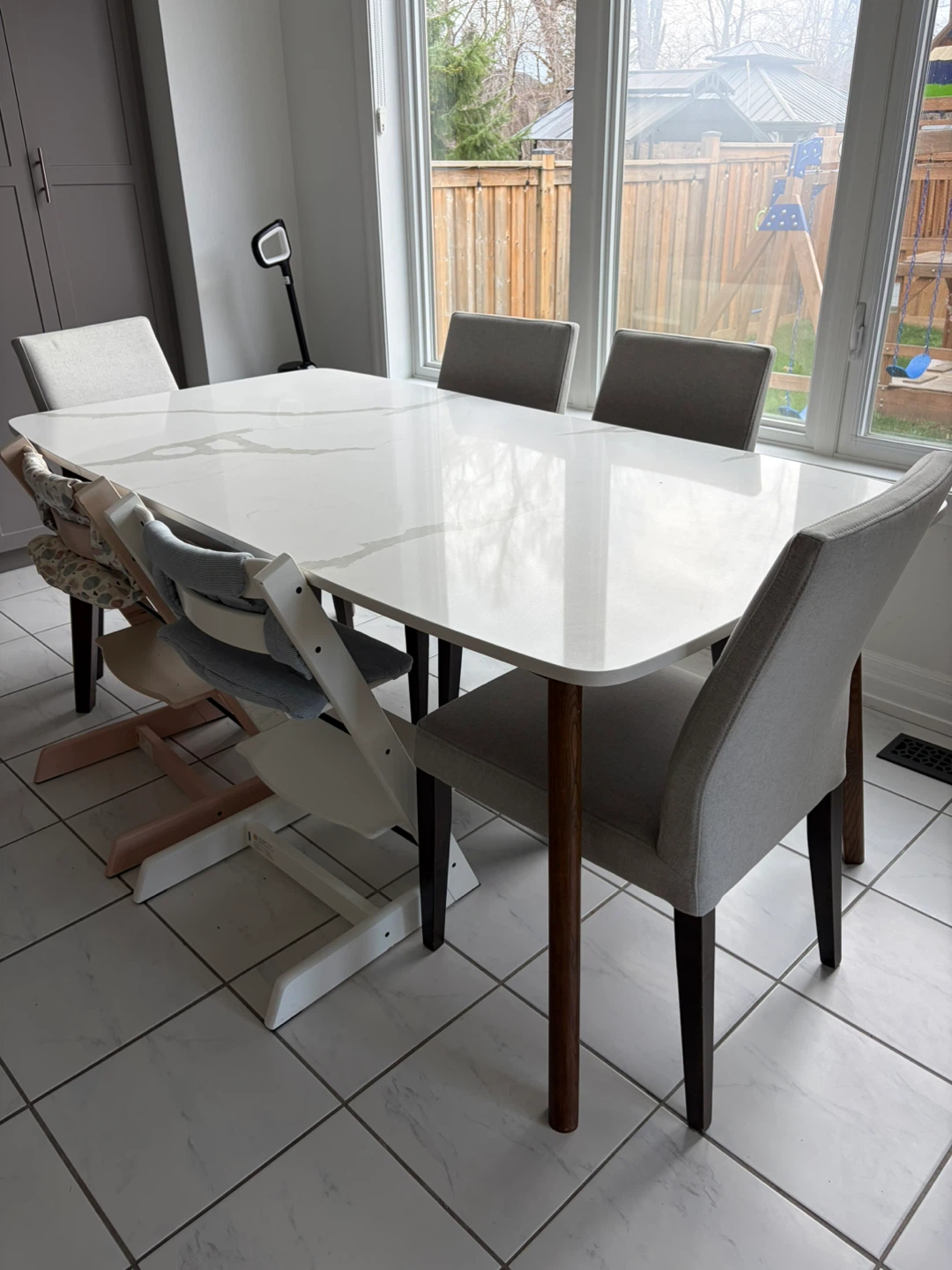 White Quartz Dining Table with Grey Chairs