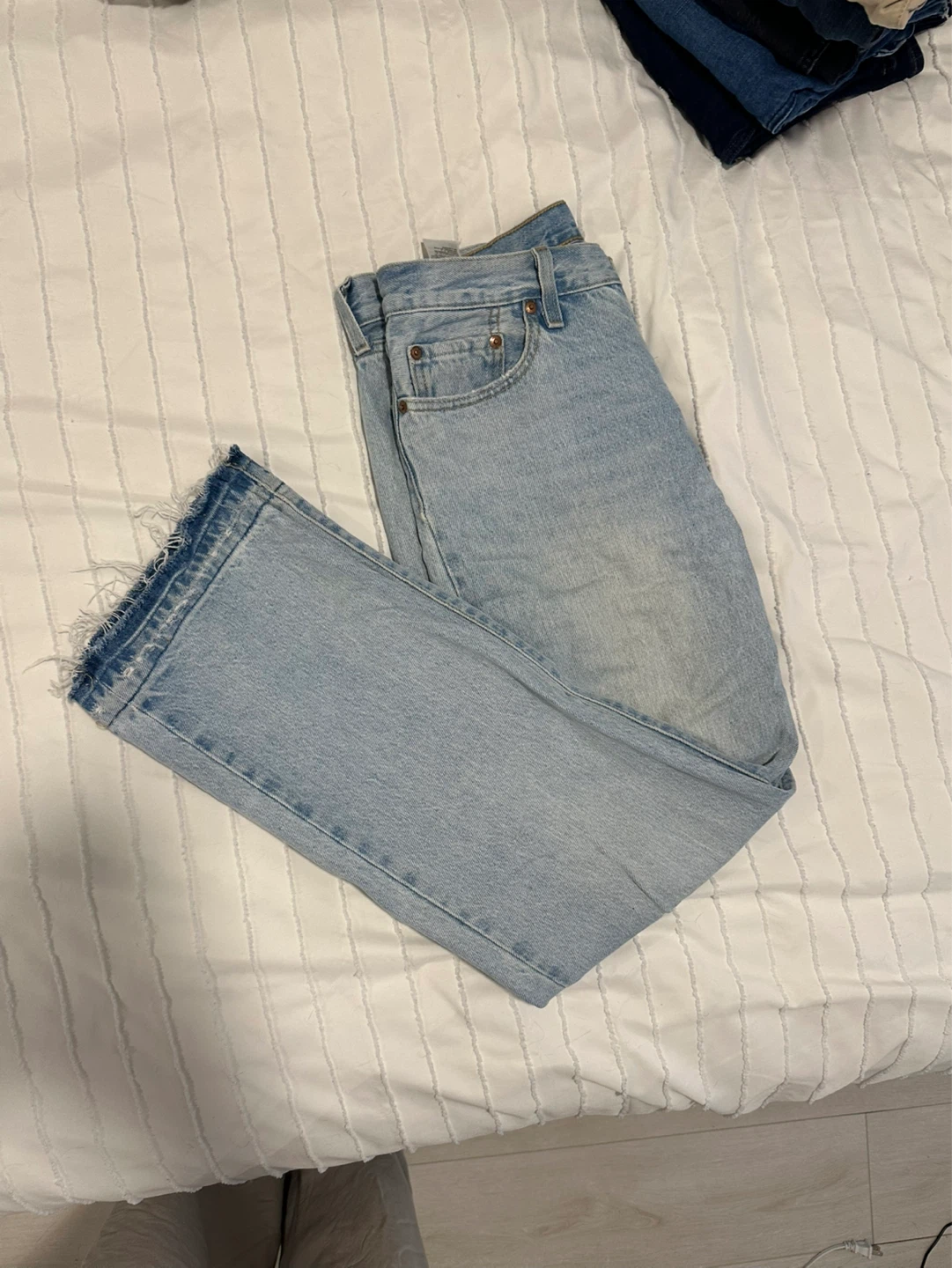 Levi's Light Wash Distressed Hem Jeans
