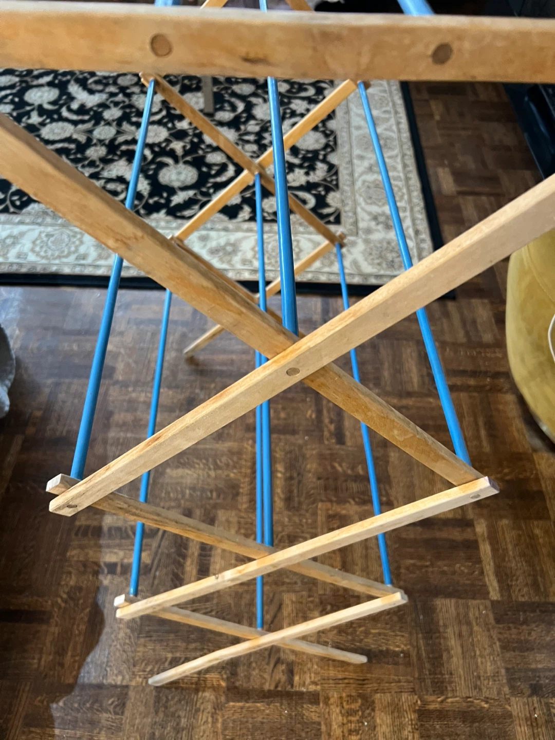 Wooden drying rack with blue bars