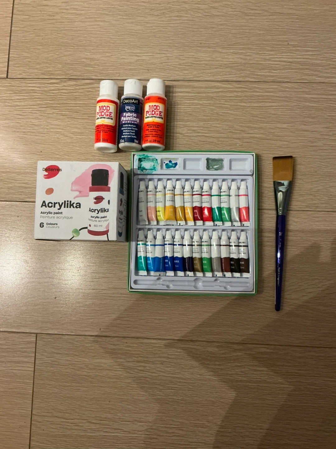Acrylic paints, media and paintbrush