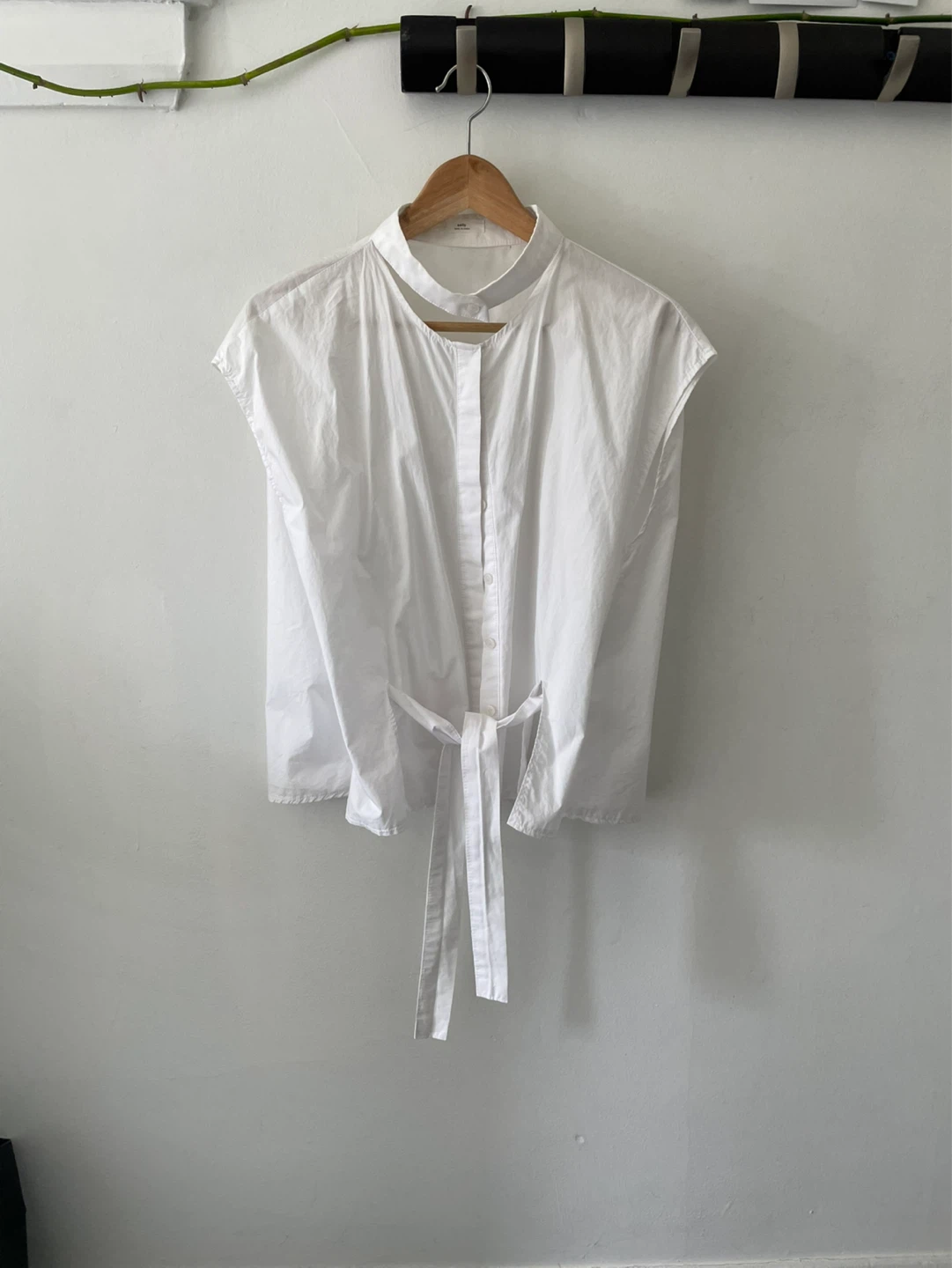 sally white sleeveless button-up shirt with tie