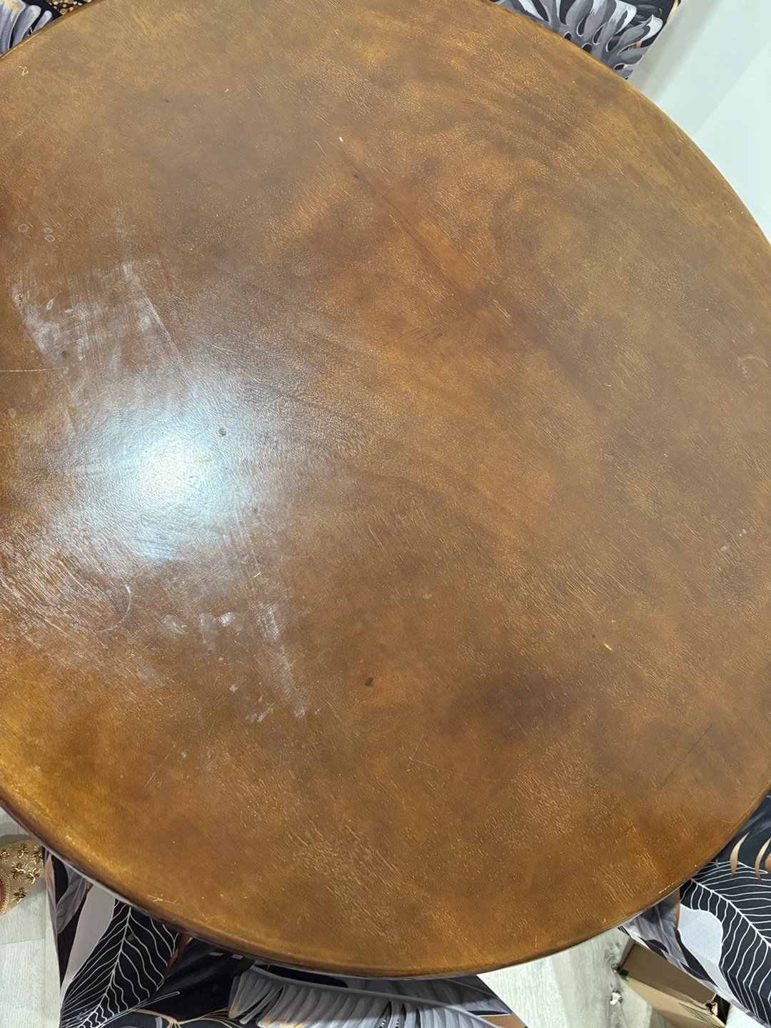 Round Wooden Table with Four Tropical Print Chair Covers