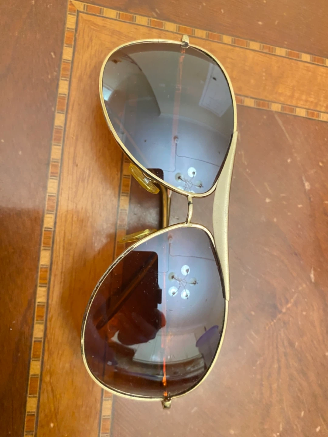 Gold-toned aviator sunglasses with brown lenses