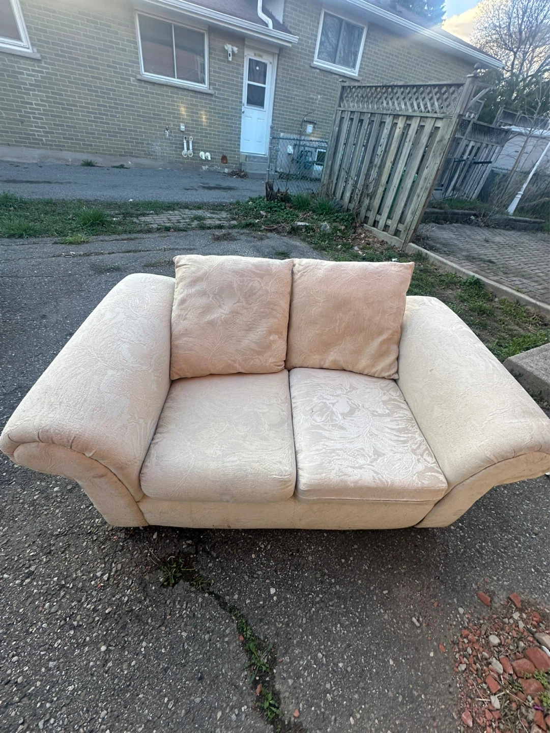 Cream patterned loveseat