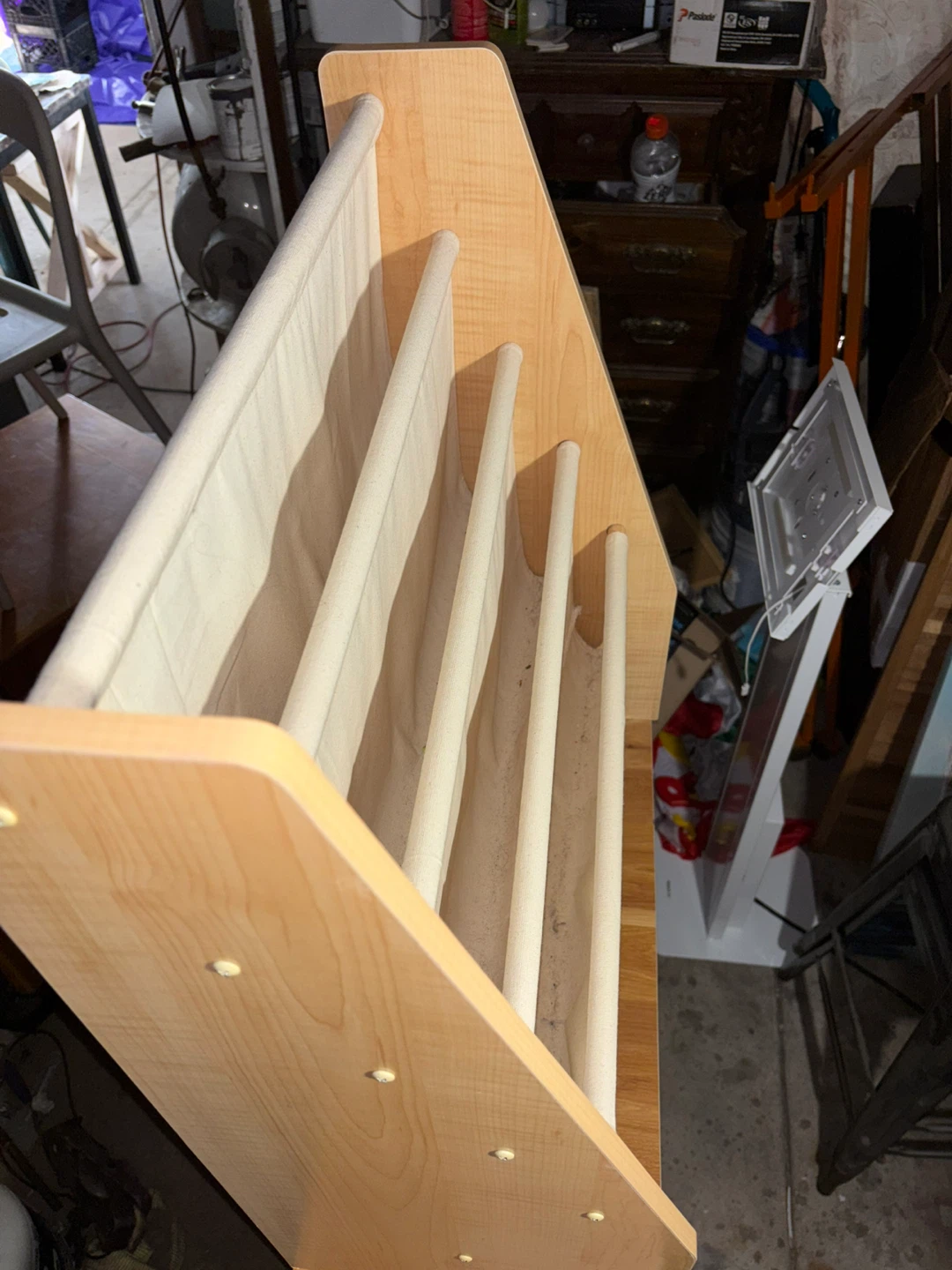 This wooden bookshelf features fabric pockets - photo 2