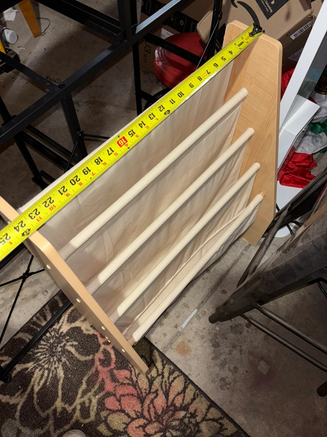 This wooden bookshelf features fabric pockets - photo 3