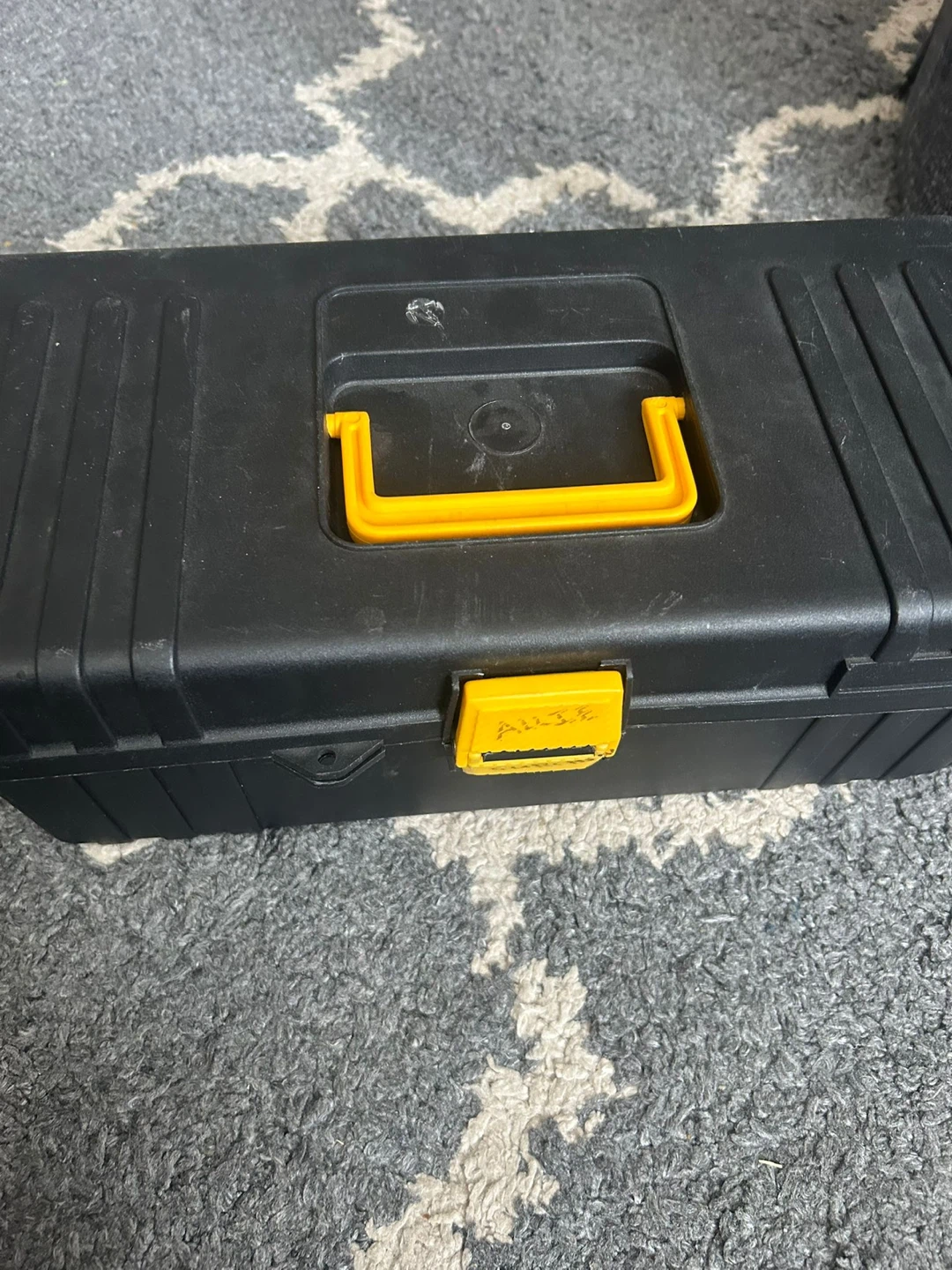 Black Toolbox with Assorted Plumbing Parts and Tools