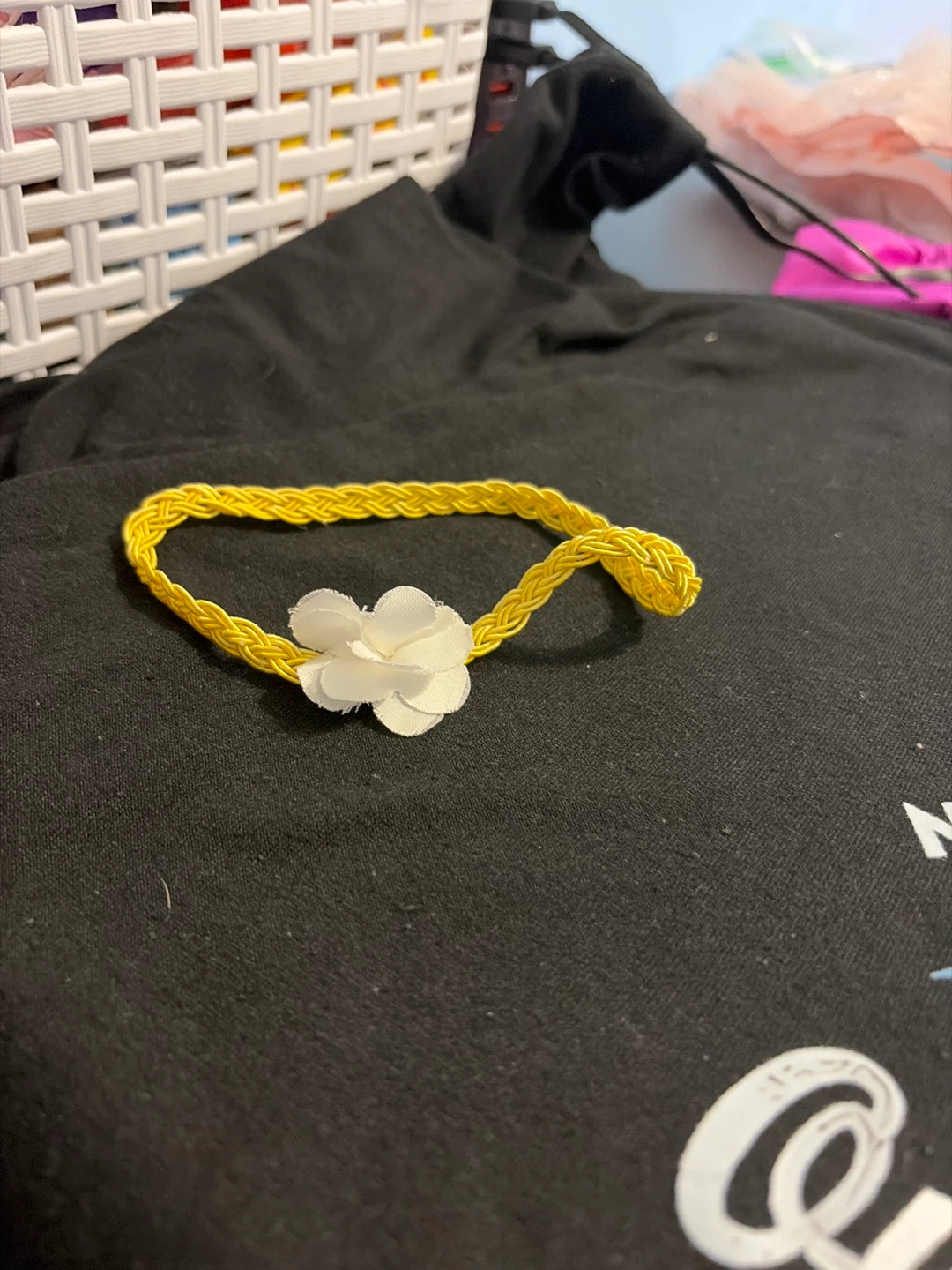 Yellow braided headband with white flower accent
