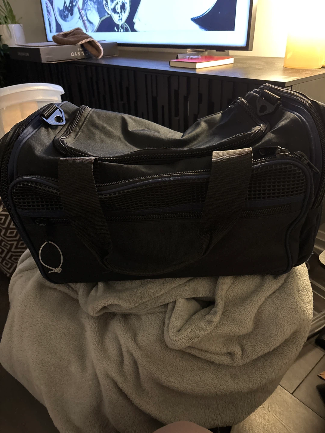 Black duffel bag with mesh accents