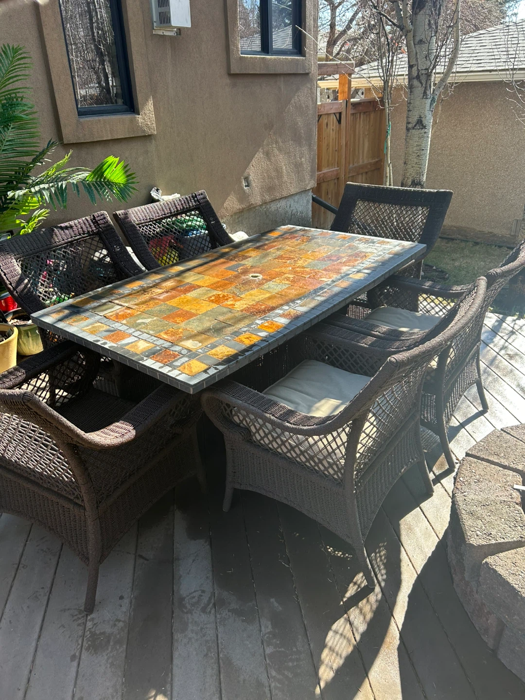 Wicker patio dining set with mosaic table
