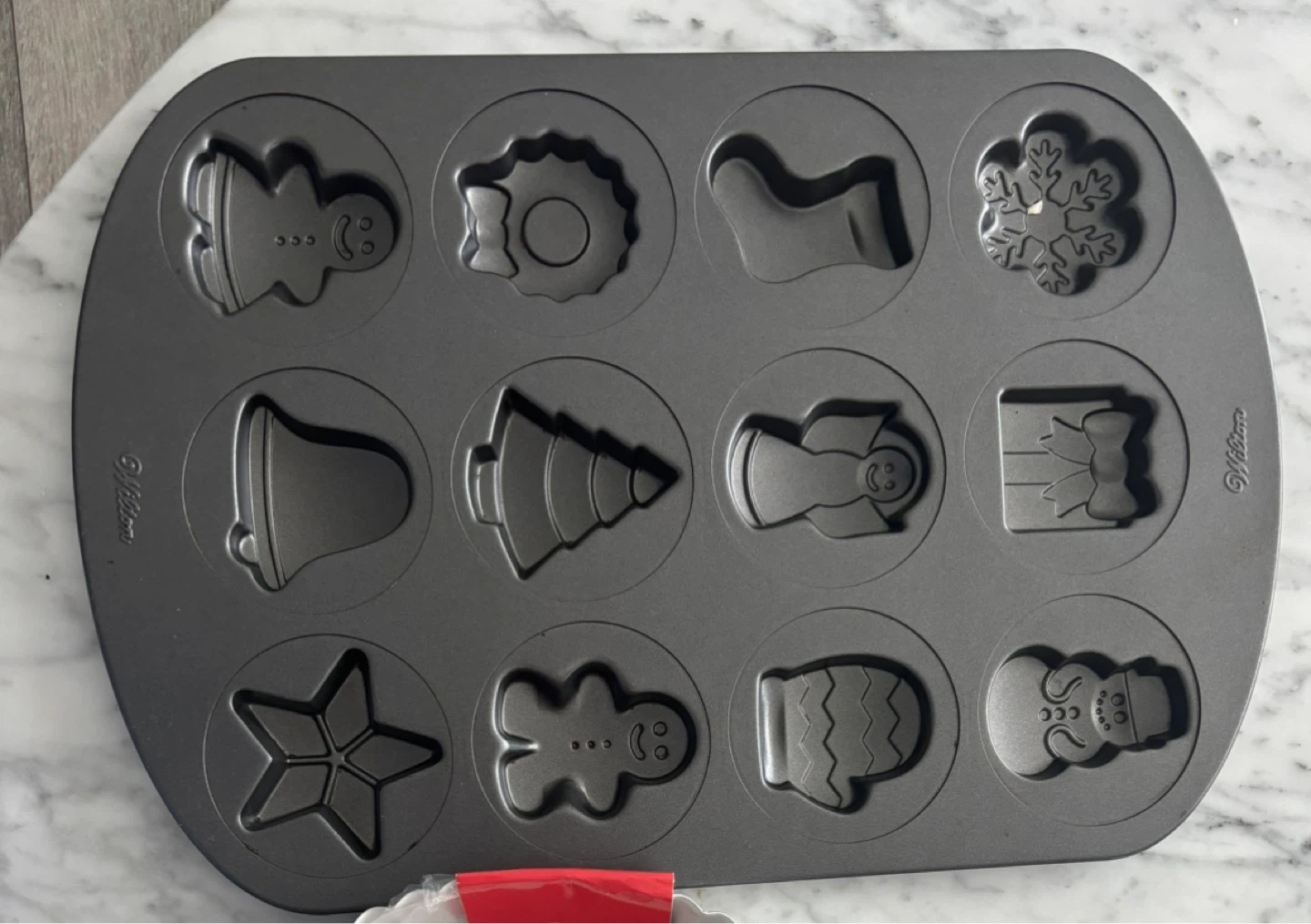 Wilton 12-Cavity Christmas Character Muffin Pan