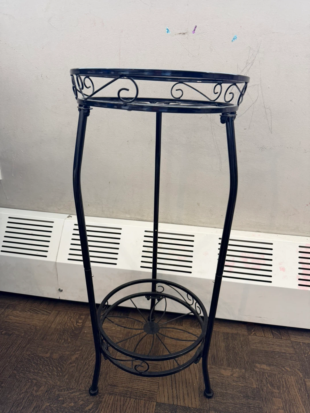 Black Metal Plant Stand with Ornate Scrollwork