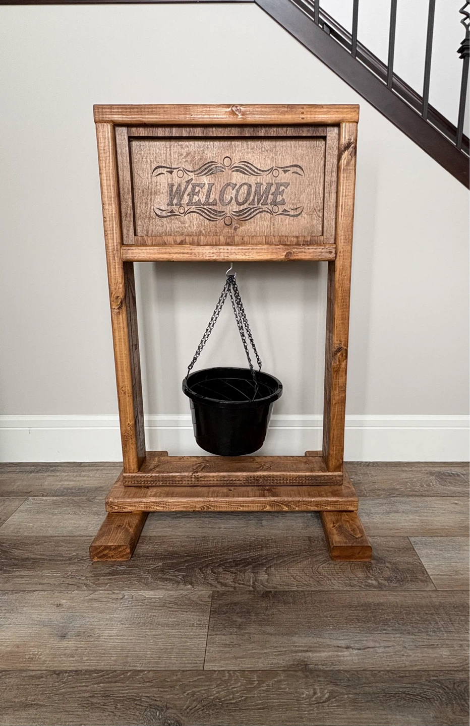 Wooden Welcome Sign with Black Bucket