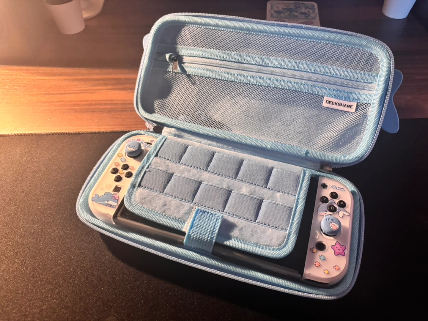 Nintendo Switch 1 With thumb grips, case.