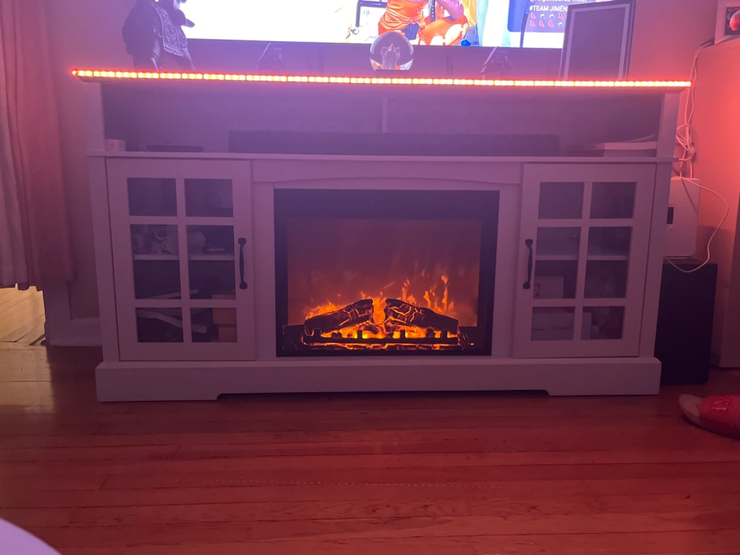 White shelf with electric fireplace. - photo 2