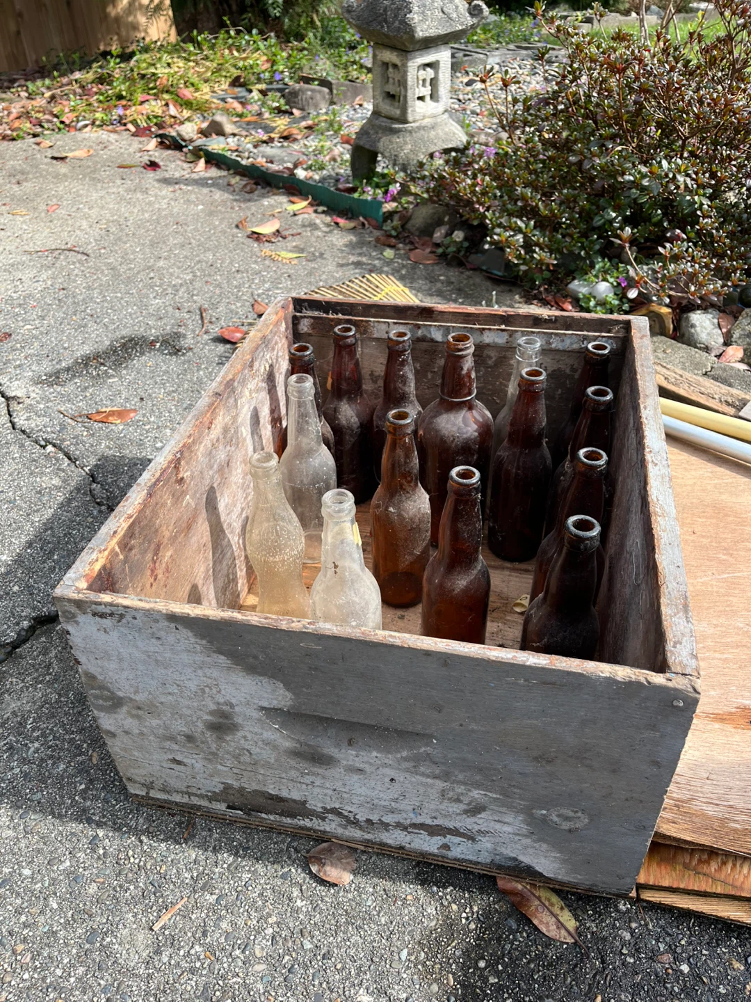 Collection of Vintage Glass Bottles with wood crate decor
