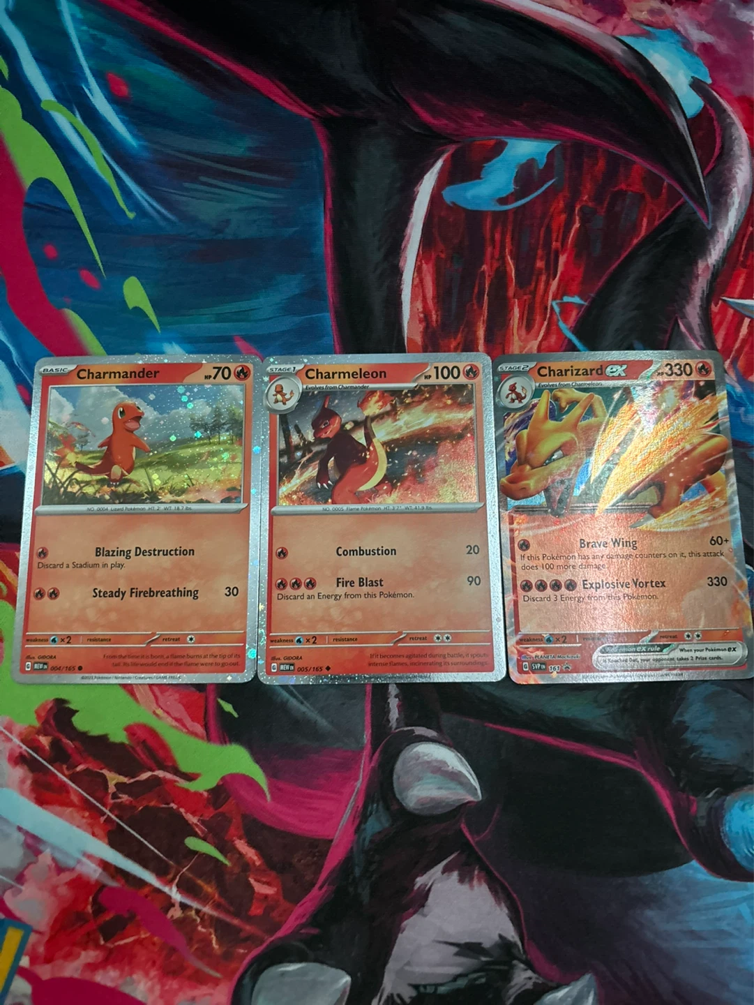 Pokemon Charmander, Charmeleon, and Charizard EX Cards