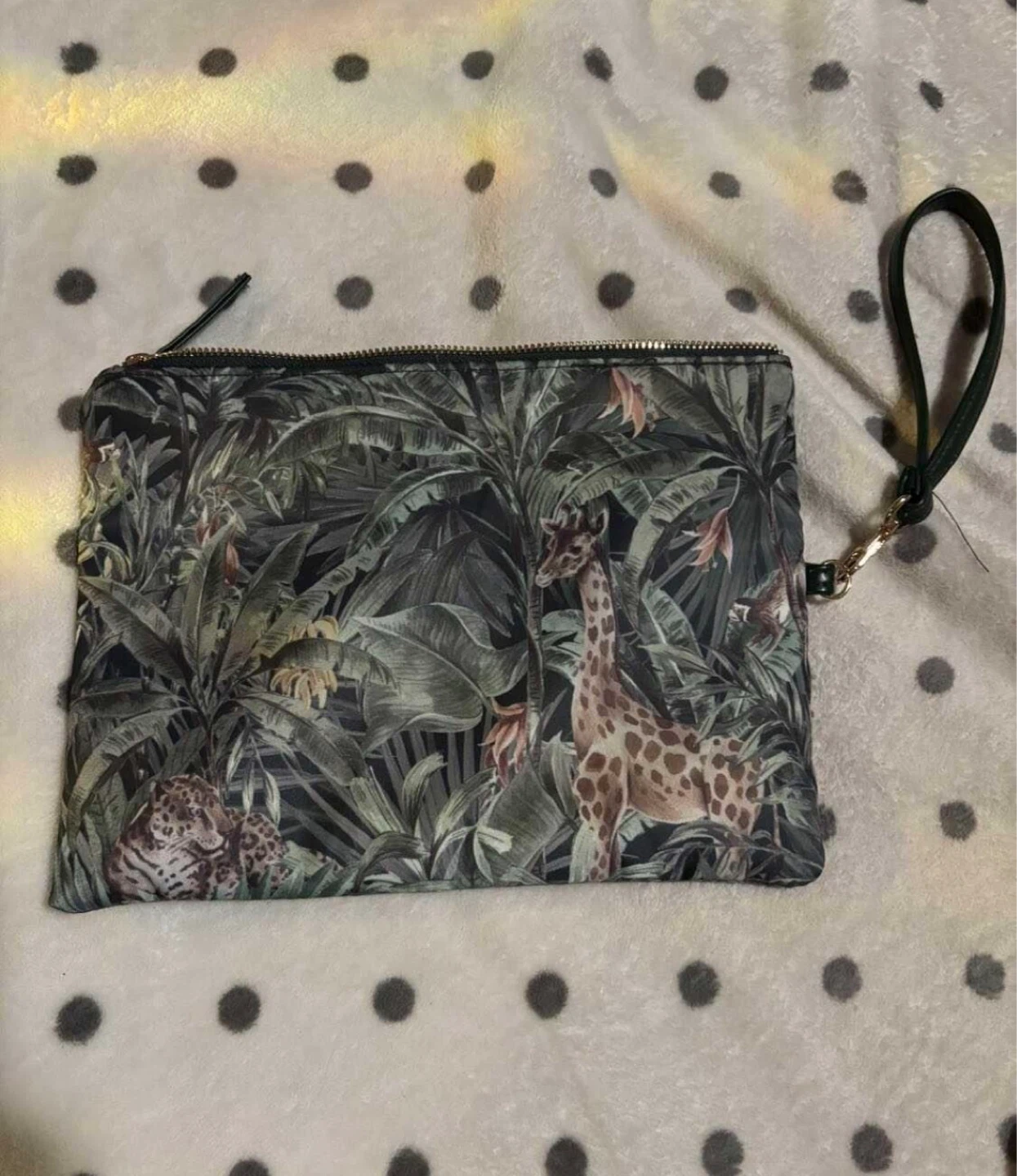 Clutch purse with jungle print and wrist strap