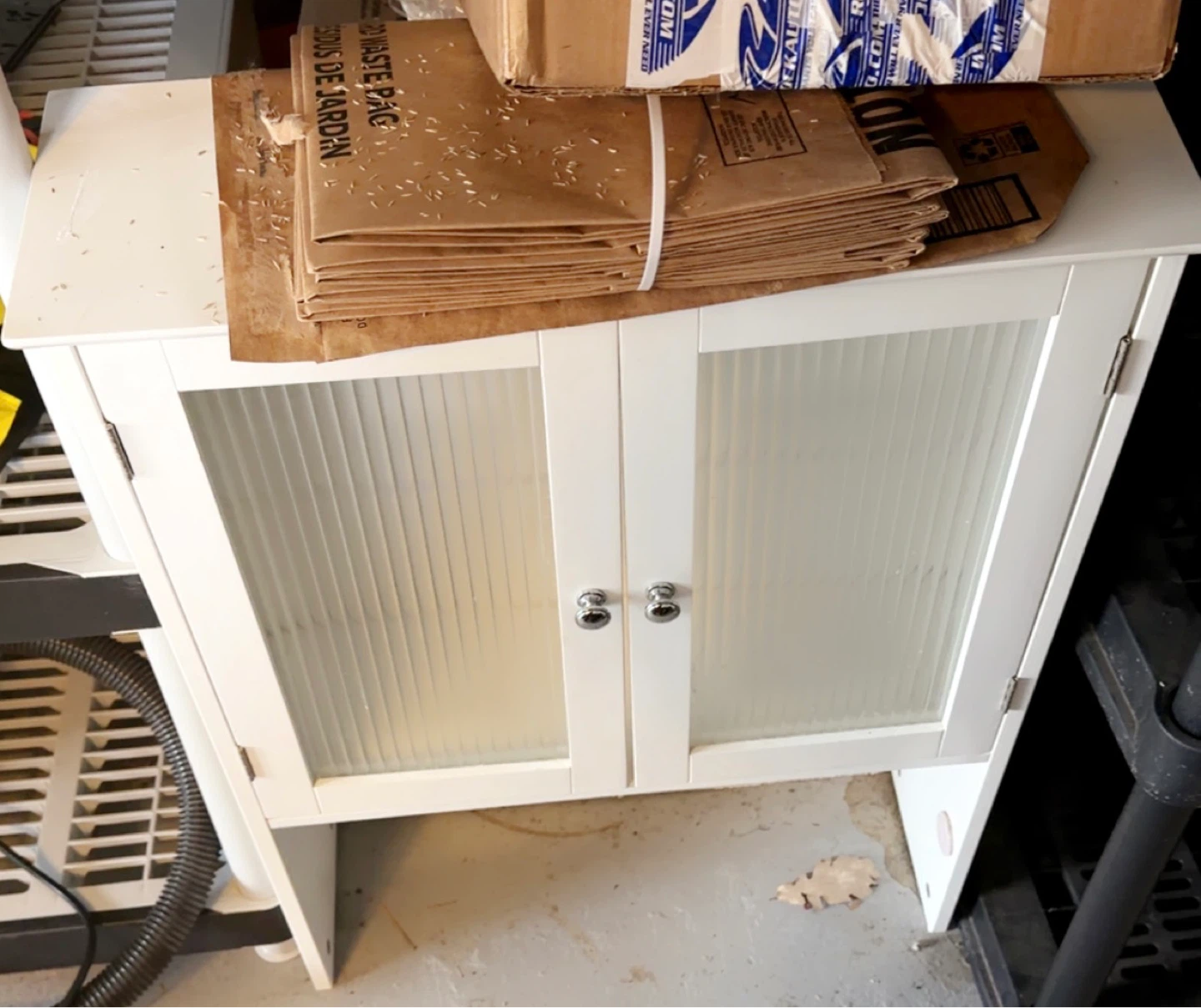 White Storage Cabinet with Fluted Glass Doors