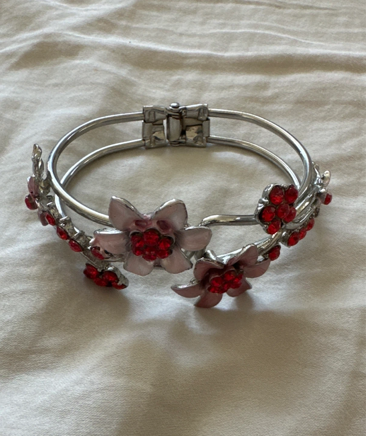 Silver-tone Bangle Bracelet with Pink Flowers and Red Jewels